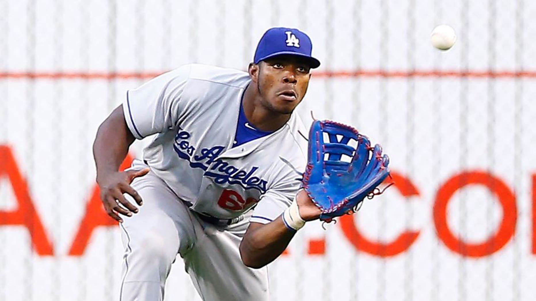 PITTSBURGH, PA - AUGUST 08: Yasiel Puig #66 of the Los Angles Dodgers catches a fly ball in right field against the Pittsburgh Pirates during the game at PNC Park on August 8, 2015 in Pittsburgh, Pennsylvania. (Photo by Jared Wickerham/Getty Images)