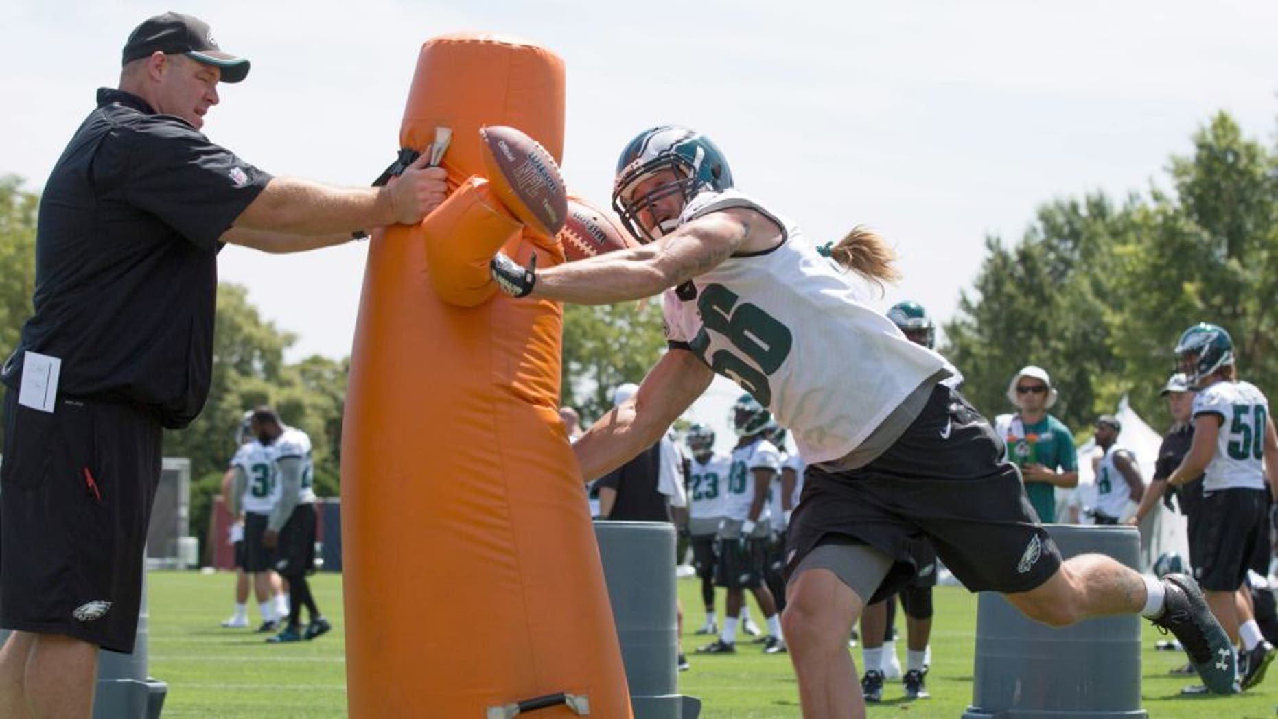 Aug 2, 2015; Philadelphia, PA, USA; Philadelphia Eagles linebacker Bryan Braman (56) attacks a tackling obstacle during training camp at NovaCare Complex. Mandatory Credit: Bill Streicher-USA TODAY Sports