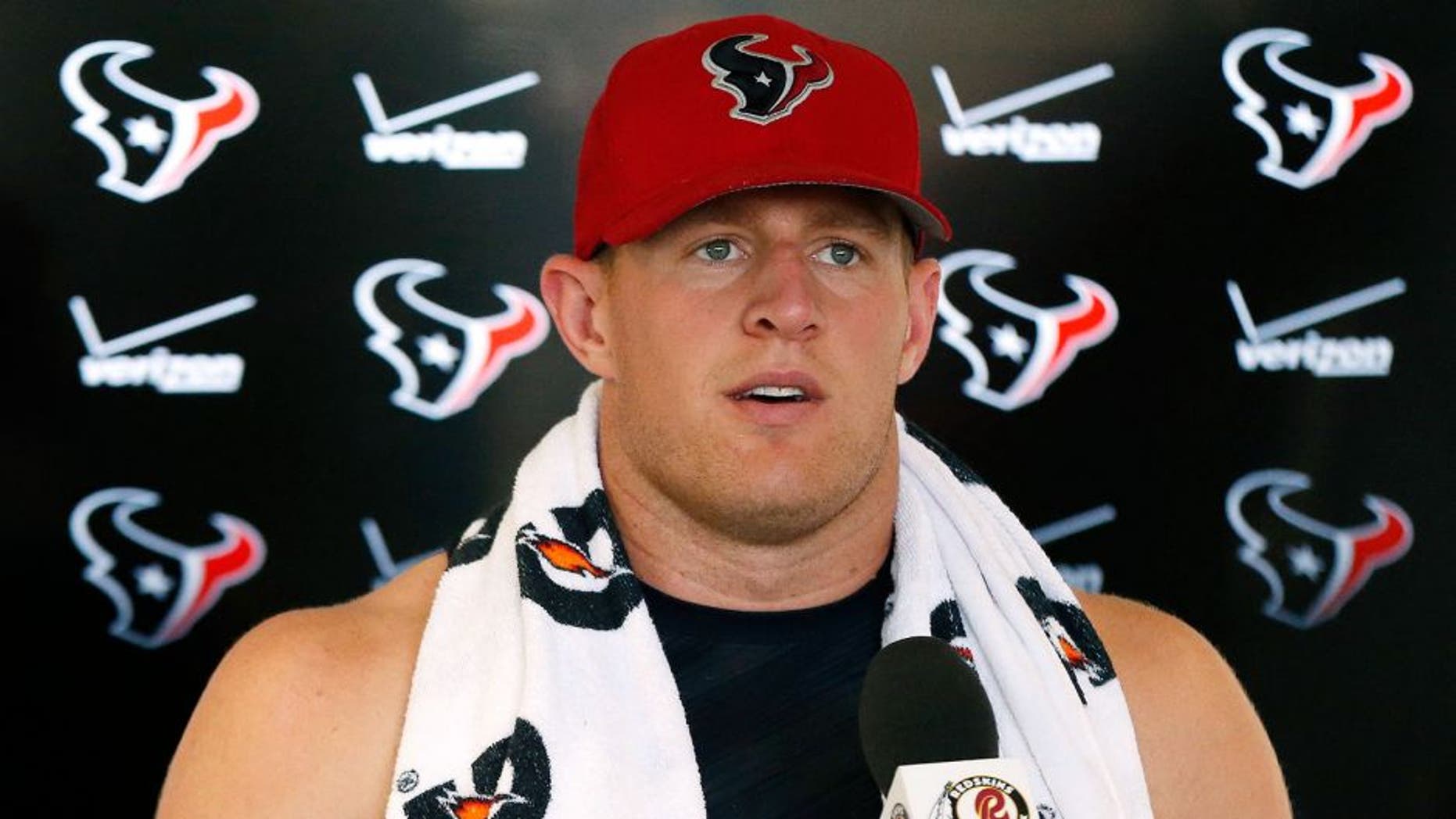 Aug 7, 2015; Richmond, VA, USA; Houston Texans defensive end J.J. Watt (99) speaks to the media after joint practice with the Washington Redskins as part of day eight of training camp at Bon Secours Washington Redskins Training Center. Mandatory Credit: Amber Searls-USA TODAY Sports