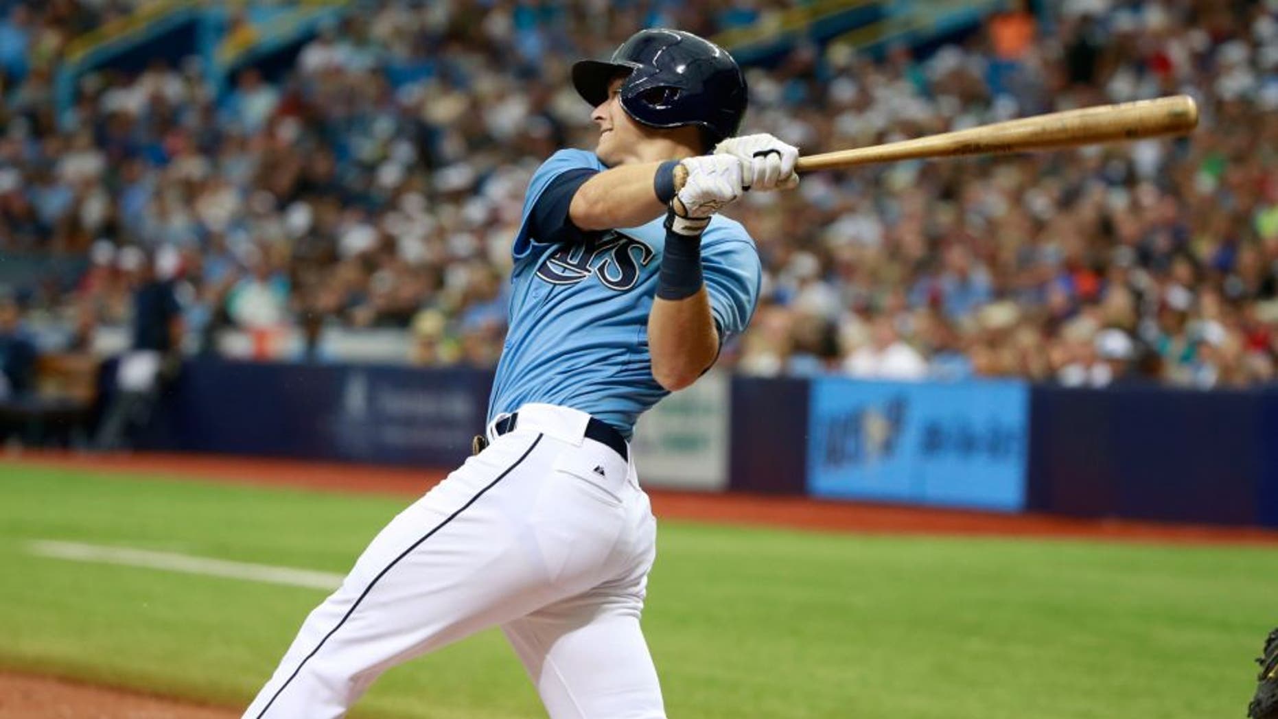 Aug 9, 2015; St. Petersburg, FL, USA; Tampa Bay Rays designator hitter Richie Shaffer (36) singles during the fifth inning against the New York Mets at Tropicana Field. Mandatory Credit: Kim Klement-USA TODAY Sports