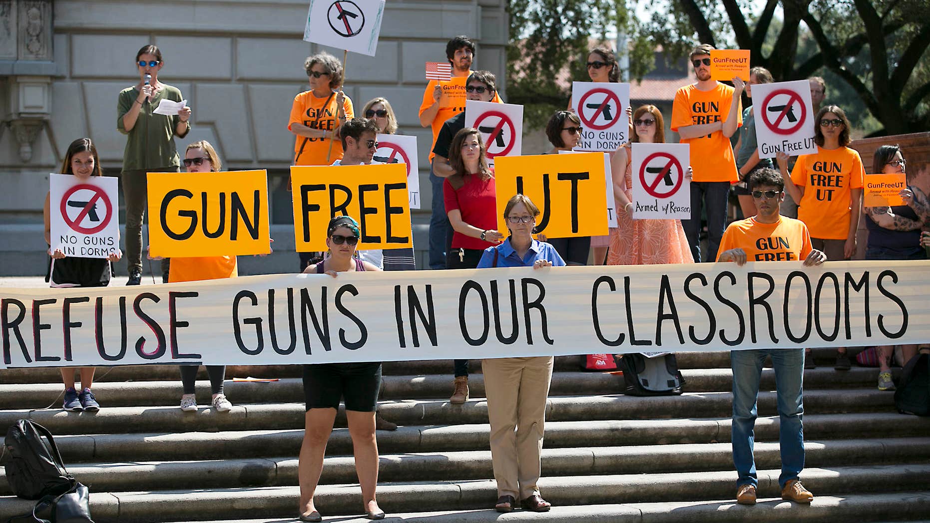 FILE - In this Oct. 1, 2015 file photo in Austin, Texas, protestors gather on the West Mall of the University of Texas campus to oppose a new state law that expands the rights of concealed handgun license holders to carry their weapons on public college campuses and as of Aug. 1, 2016, they can carry in campus buildings.