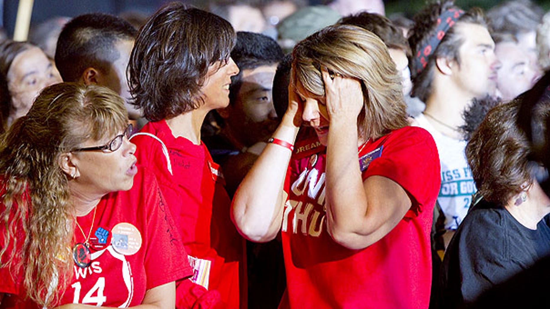 August 10: Norma Furger, right, a school teacher from Lodi, Wisconsin, reacts to the news that Democratic candidates were losing ground to Republican candidates.