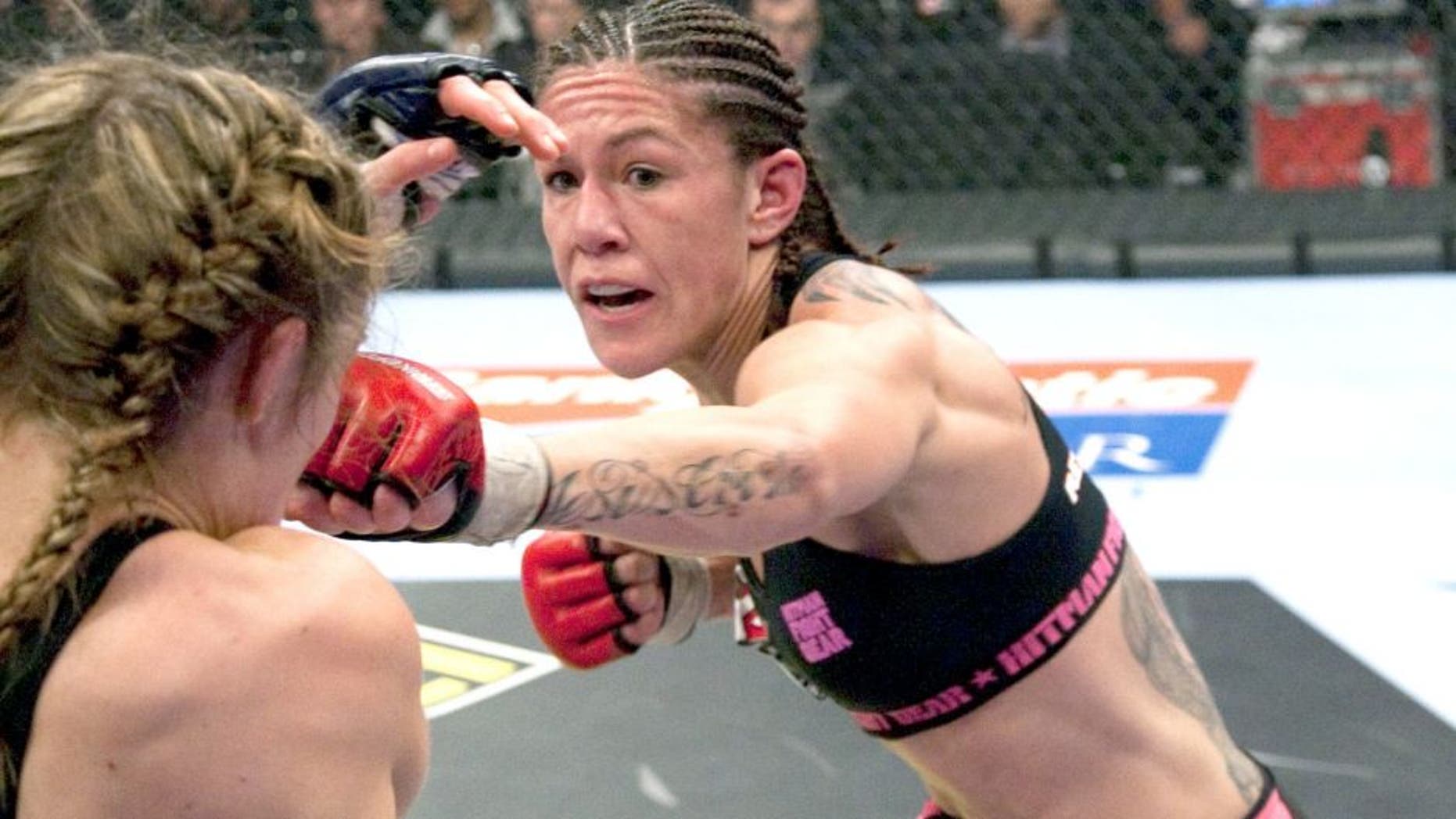 SUNRISE, FL - JANUARY 30: (R-L) Cristiane "Cyborg" Santos punches Marloes Coenen during the Women's Featherweight Championship bout at the Strikeforce Miami event on January 30, 2010 in Sunrise, Florida. (Photo by Esther Lin/Forza LLC/Forza LLC via Getty Images)