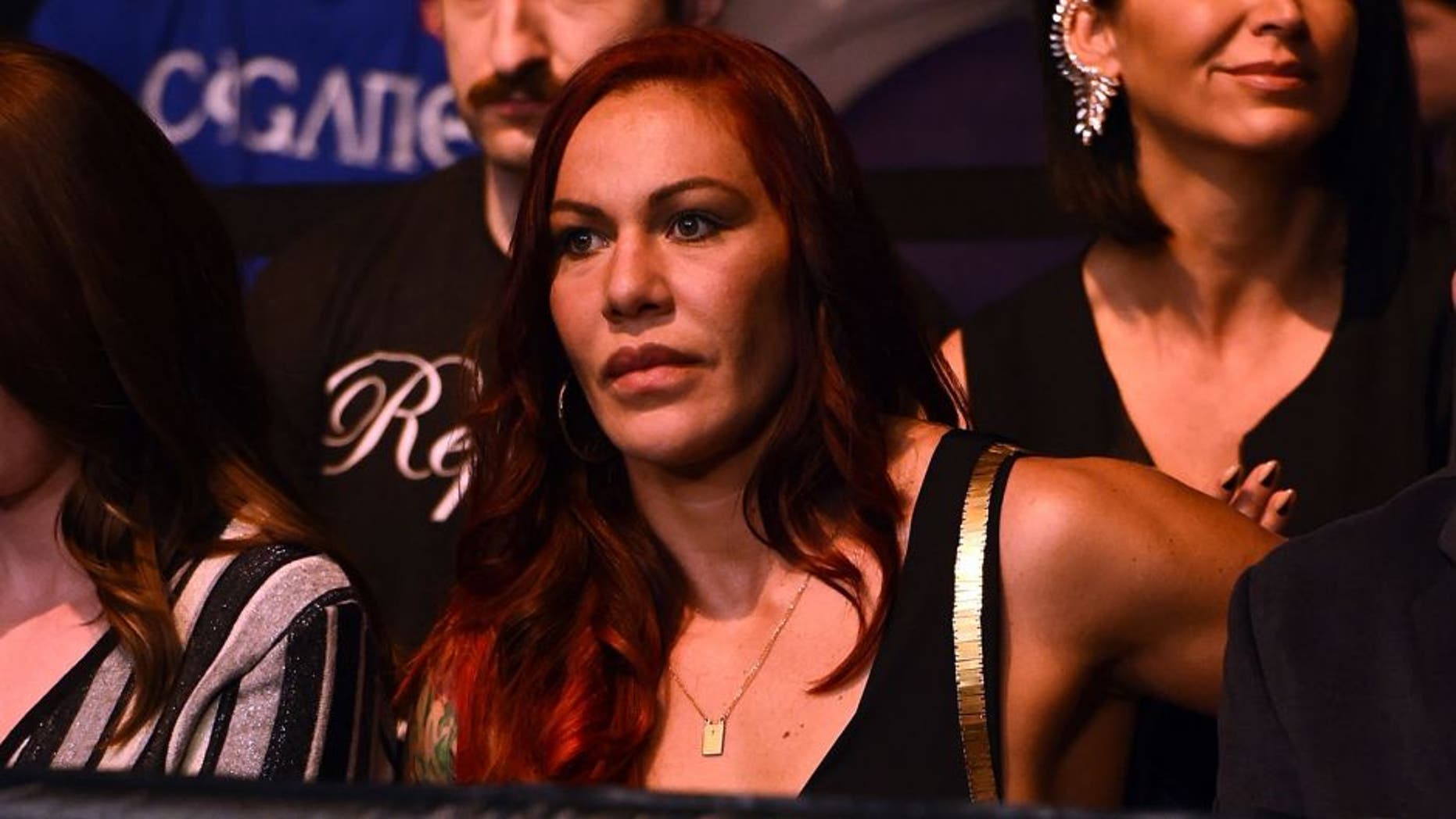 PHOENIX, AZ - DECEMBER 13: Cristiane 'Cyborg' Justino sits Octagonside during the UFC Fight Night event at the U.S. Airways Center on December 13, 2014 in Phoenix, Arizona. (Photo by Josh Hedges/Zuffa LLC/Zuffa LLC via Getty Images)