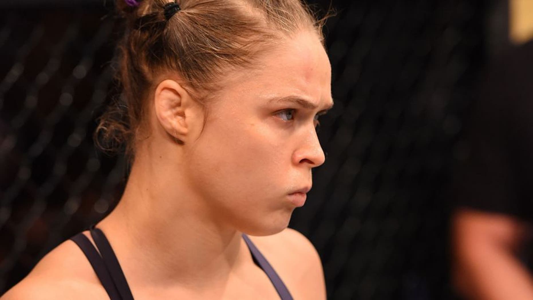 RIO DE JANEIRO, BRAZIL - AUGUST 01: UFC strawweight champion Ronda Rousey of the United States enters the Octagon before facing Bethe Correia of Brazil in their UFC women's bantamweight championship bout during the UFC 190 event inside HSBC Arena on August 1, 2015 in Rio de Janeiro, Brazil. (Photo by Josh Hedges/Zuffa LLC/Zuffa LLC via Getty Images)