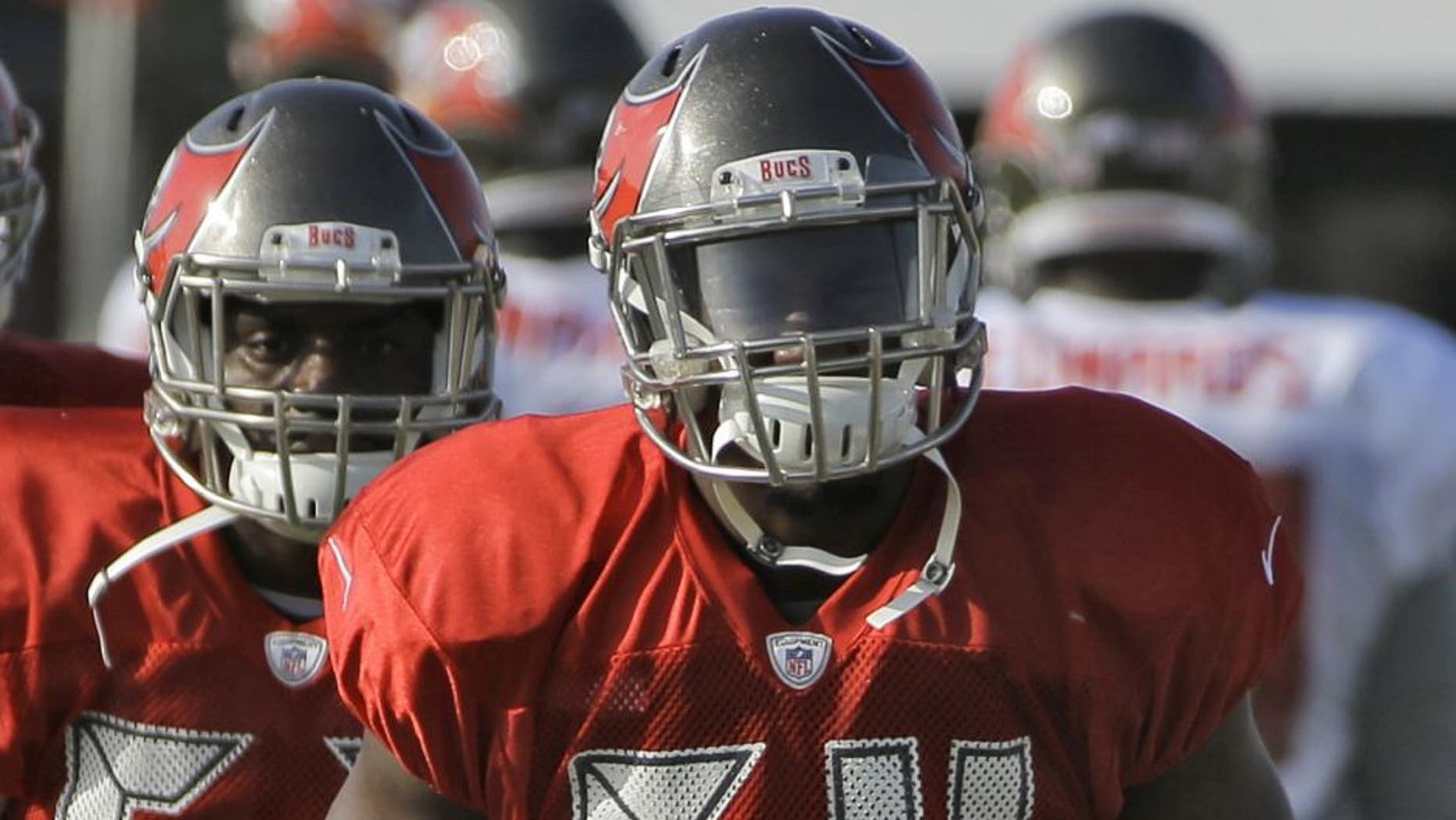 Tampa Bay Buccaneers outside linebacker Lavonte David (54) stretches with teammates during NFL football training camp, Tuesday, Aug. 4, 2015, in Tampa, Fla. (AP Photo/Chris O'Meara)