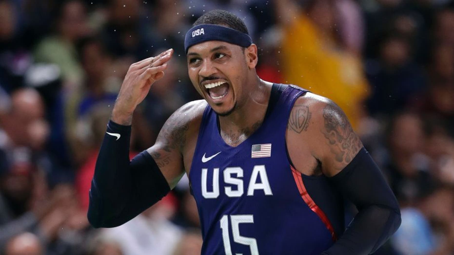 United States' Carmelo Anthony (15) celebrates after making a three-point basket during a basketball game against Australia at the 2016 Summer Olympics in Rio de Janeiro, Brazil, Wednesday, Aug. 10, 2016. (AP Photo/Charlie Neibergall)