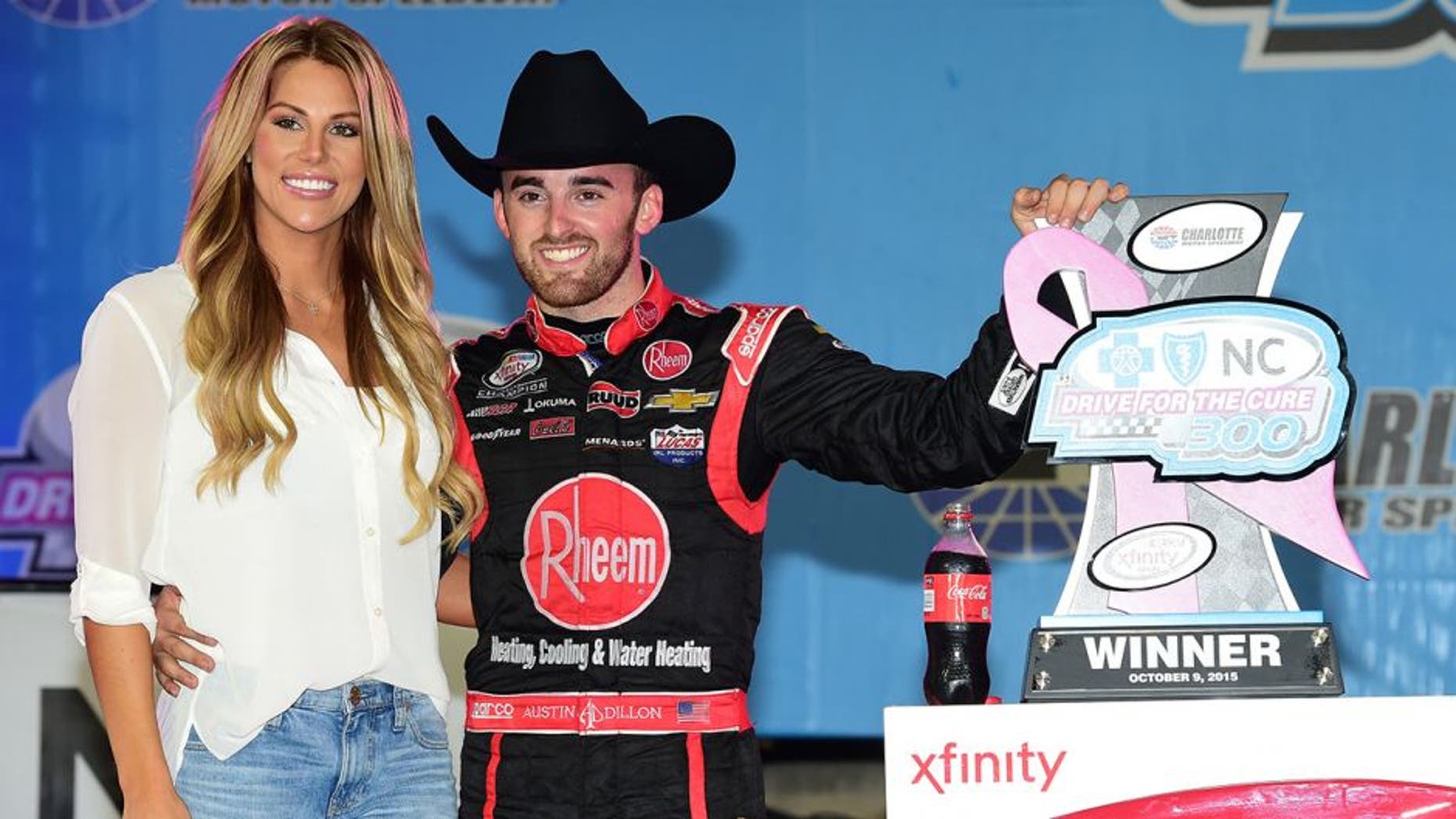CHARLOTTE, NC - OCTOBER 09: Austin Dillon, driver of the #33 Rheem Chevrolet, celebrates in victory lane with his girlfriend and Titans cheerleader Whitney Ward after winning the NASCAR XFINITY Series Drive for the Cure 300 at Charlotte Motor Speedway on October 9, 2015 in Charlotte, North Carolina. (Photo by Jared C. Tilton/NASCAR via Getty Images)
