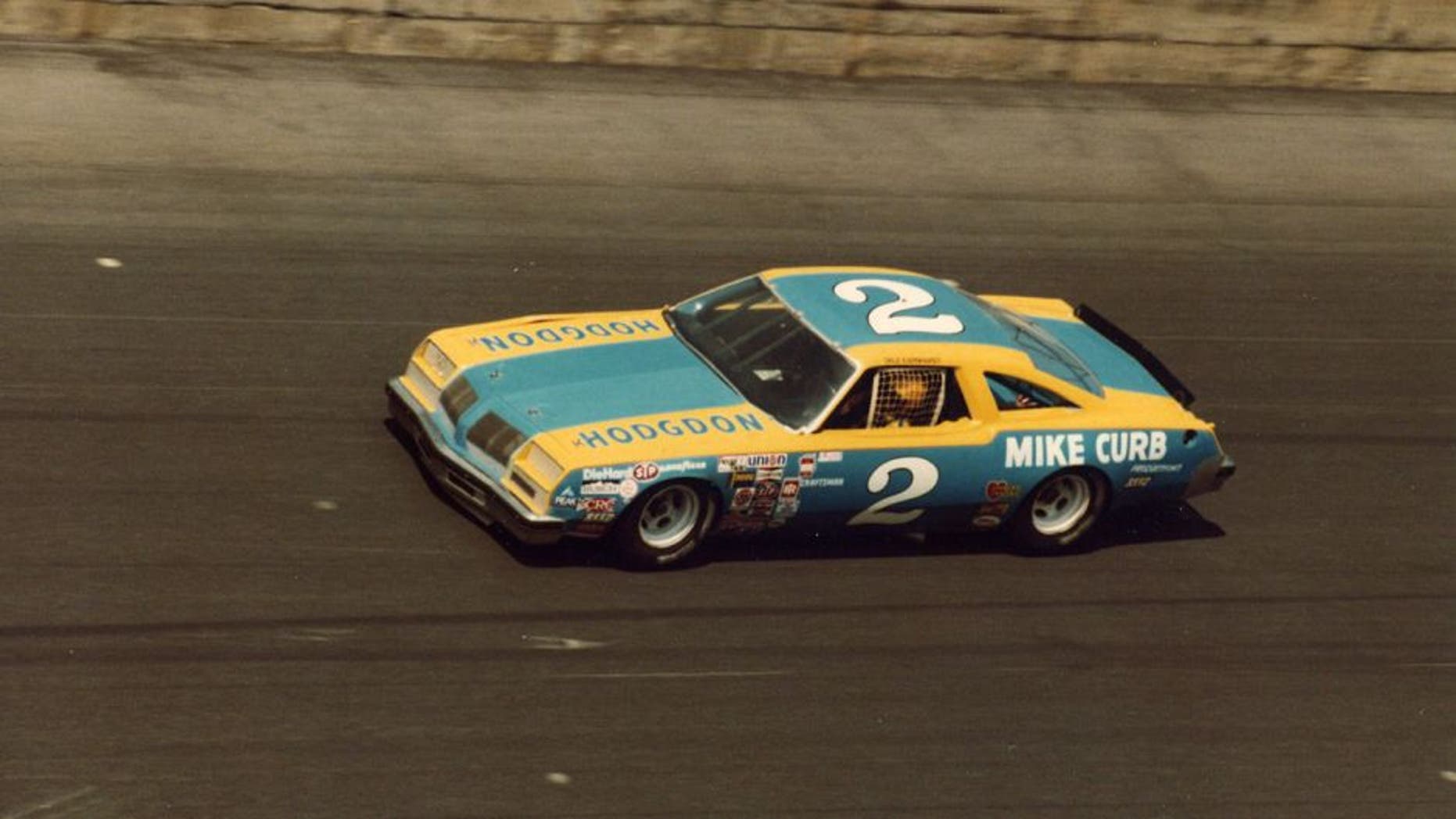 DAYTONA BEACH, FL - FEBRUARY 17: Dale Earnhardt driver of the #2 Rod Osterlund Chevrolet races during the 1980 Winston Cup Daytona 500 at the Daytona International Speedway on February 17, 1980 in Daytona Beach, Florida. The team picked up their first sponsorship in Mike Curb Productions, a music recording company out of California. (Photo by ISC Archives via Getty Images)