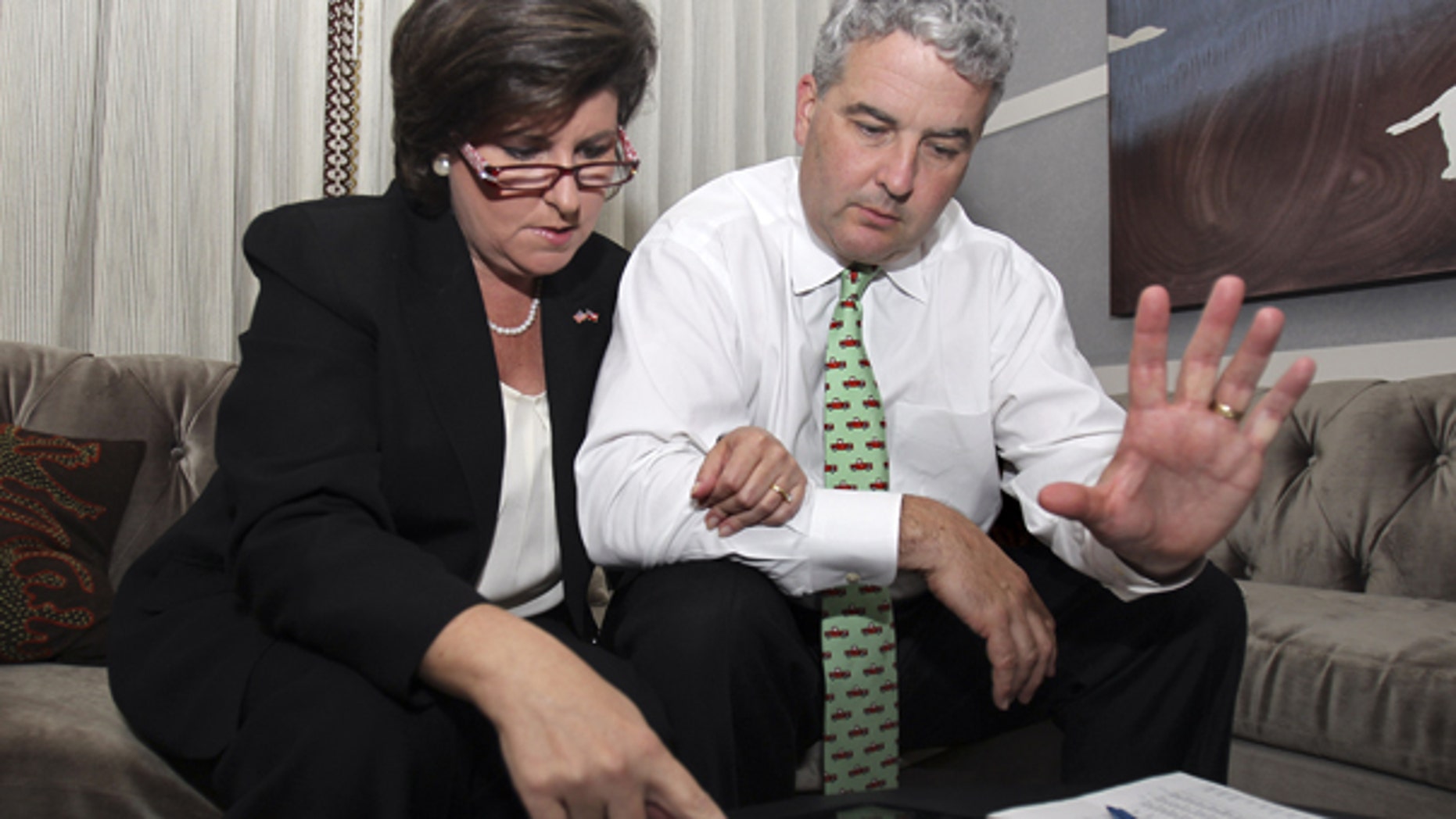 Aug. 10: Georgia gubernatorial candidate Karen Handel and her husband Steve Handel look over early returns after the polls closed Tuesday night in Atlanta.