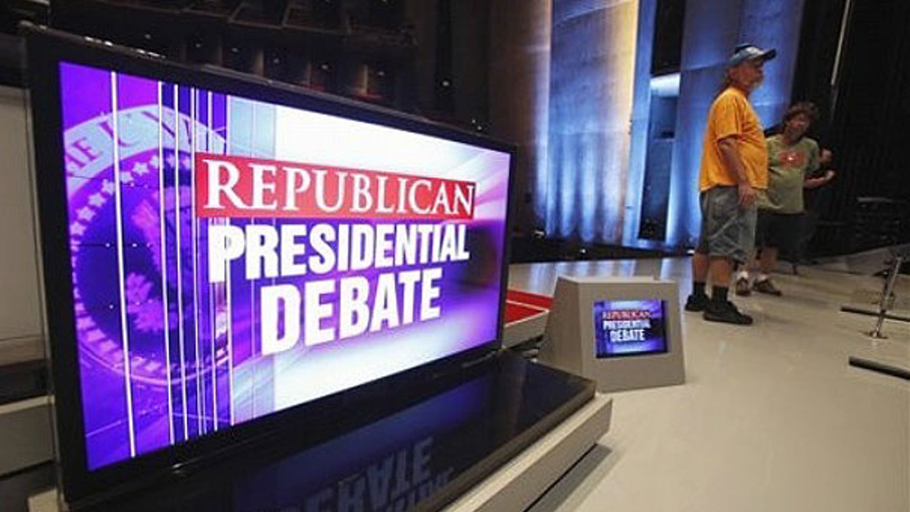 August 10: Workers are seen on stage at CY Stephens Auditorium in Ames, Iowa, during setup up for Thursday's Iowa GOP/Fox News Debate.