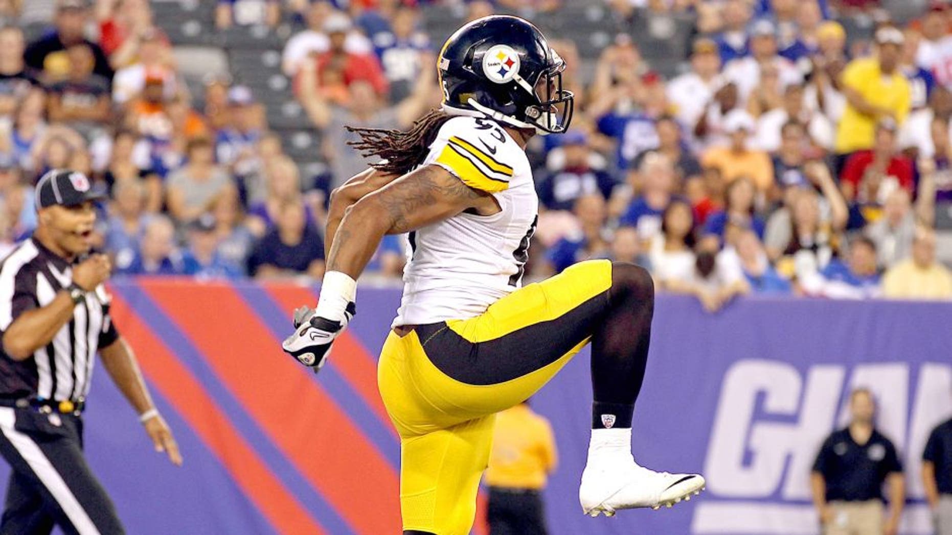 Aug 9, 2014; East Rutherford, NJ, USA; Pittsburgh Steelers outside linebacker Jarvis Jones (95) celebrates after sacking New York Giants quarterback Eli Manning (10) during the first quarter at MetLife Stadium. Mandatory Credit: Adam Hunger-USA TODAY Sports