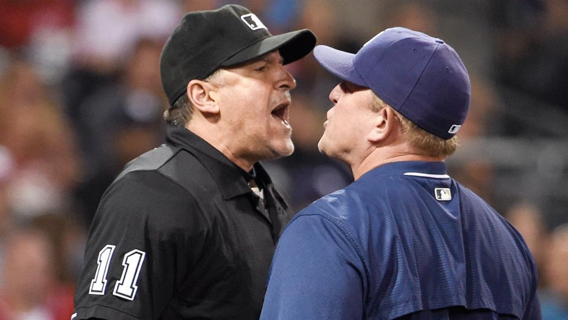 SAN DIEGO, CA - AUGUST 10: Home plate umpire Tony Randazzo and Pat Murphy #24 interim manager of the San Diego Padres argue after Murphy was ejected from the game during the fourth inning of a baseball game against the Cincinnati Reds at Petco Park August 10, 2015 in San Diego, California. (Photo by Denis Poroy/Getty Images)