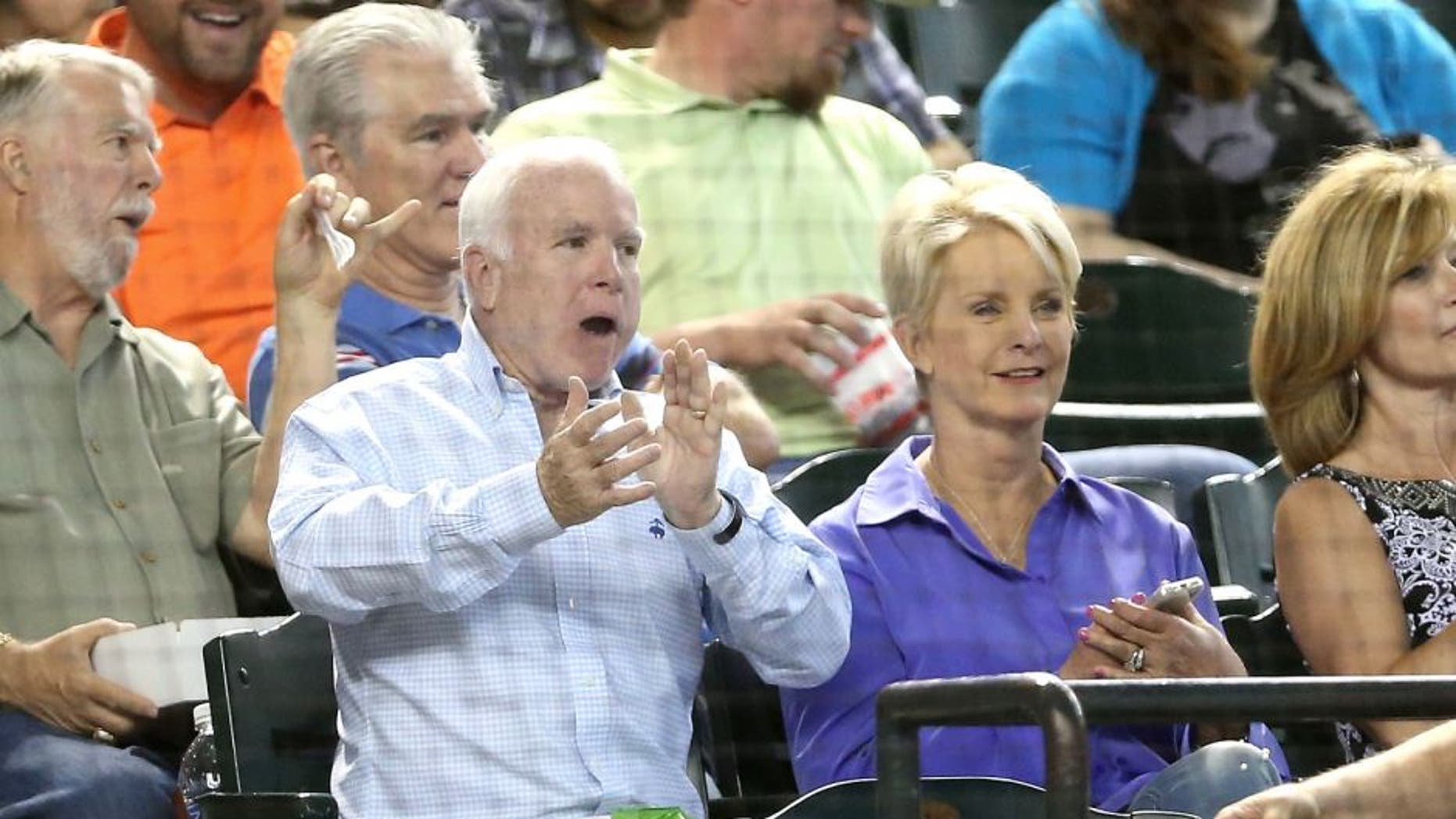 PHOENIX, AZ - MAY 17: U.S. Senator John McCain (R-AZ) and wife Cindy attend the MLB game between the Arizona Diamondbacks and the Los Angeles Dodgers at Chase Field on May 17, 2014 in Phoenix, Arizona. (Photo by Christian Petersen/Getty Images)