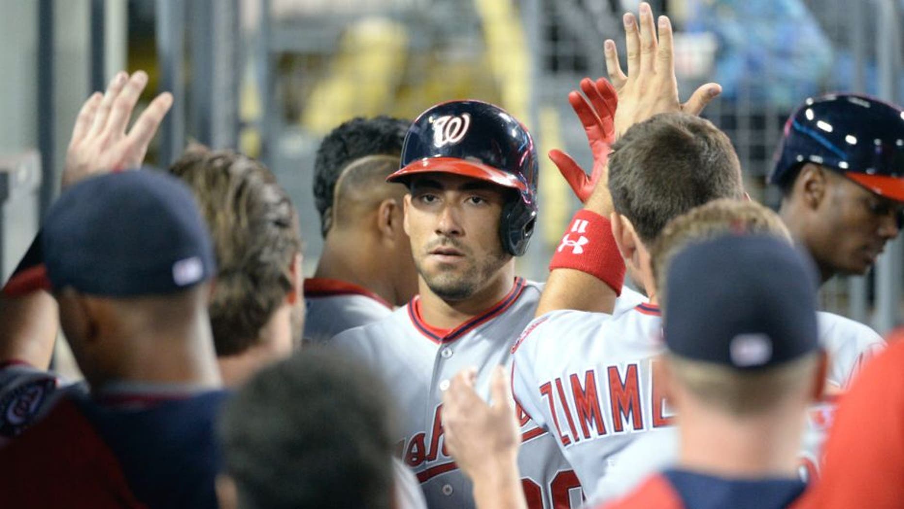 Aug 10, 2015; Los Angeles, CA, USA; Washington Nationals shortstop Ian Desmond (20) celebrates scoring against the Los Angeles Dodgers during the eighth inning at Dodger Stadium. Mandatory Credit: Richard Mackson-USA TODAY Sports
