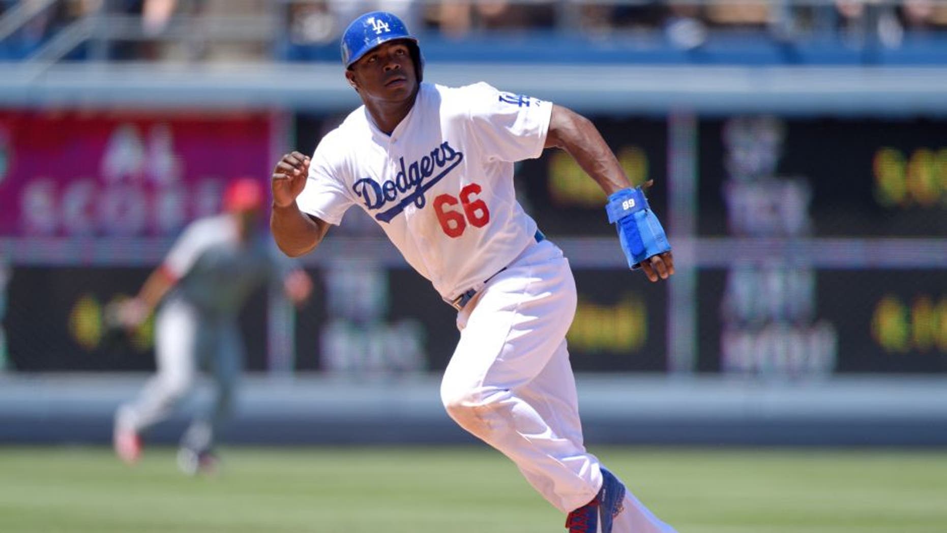 LOS ANGELES, CA - AUGUST 1: Yasiel Puig #66 of the Los Angeles Dodgers runs during the game against the Los Angeles Angels of Anaheim at Dodger Stadium on August 1, 2015 in Los Angeles, California. (Photo by Matt Brown/Angels Baseball LP/Getty Images)