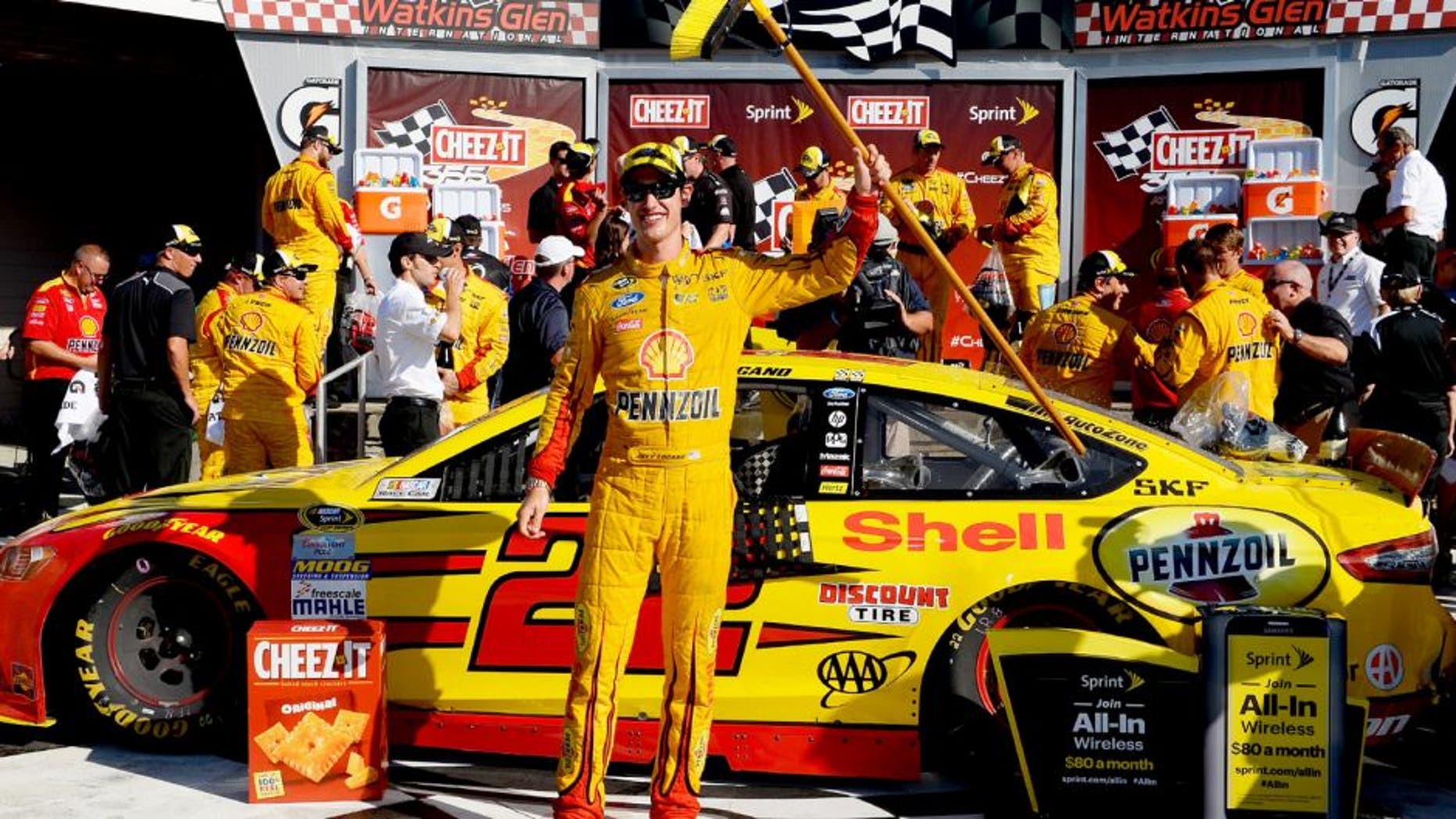 WATKINS GLEN, NY - AUGUST 09: Joey Logano, driver of the #22 Shell Pennzoil Ford, celebrates in victory lane after winning the NASCAR Sprint Cup Series Cheez-It 355 at the Glen at Watkins Glen International on August 9, 2015 in Watkins Glen, New York. (Photo by Robert Laberge/NASCAR via Getty Images)