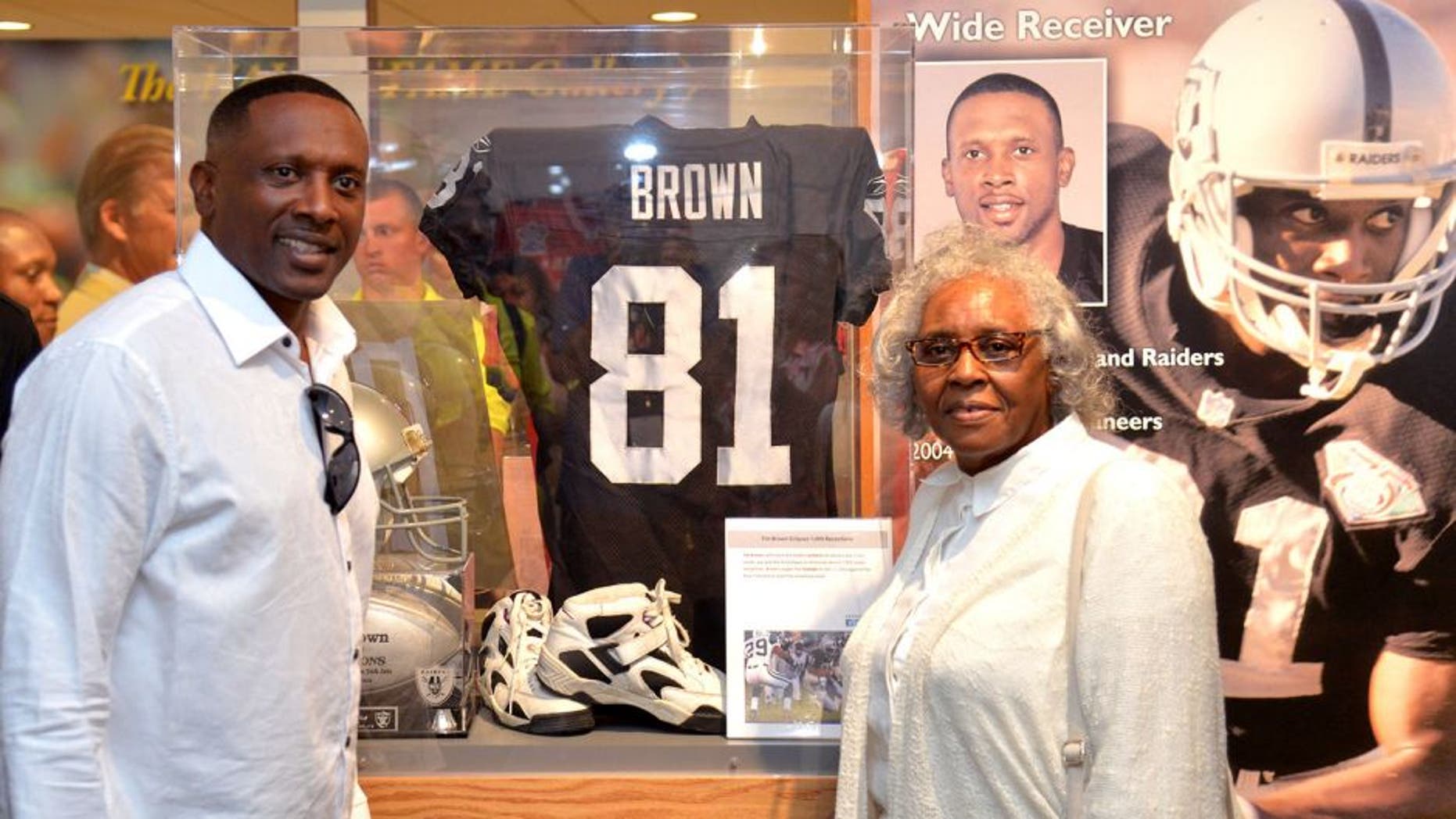 Aug 9, 2015; Canton, OH, USA; Tim Brown (left) poses with his mother Josephine Brown at the Pro Football Hall of Fame. Mandatory Credit: Kirby Lee-USA TODAY Sports