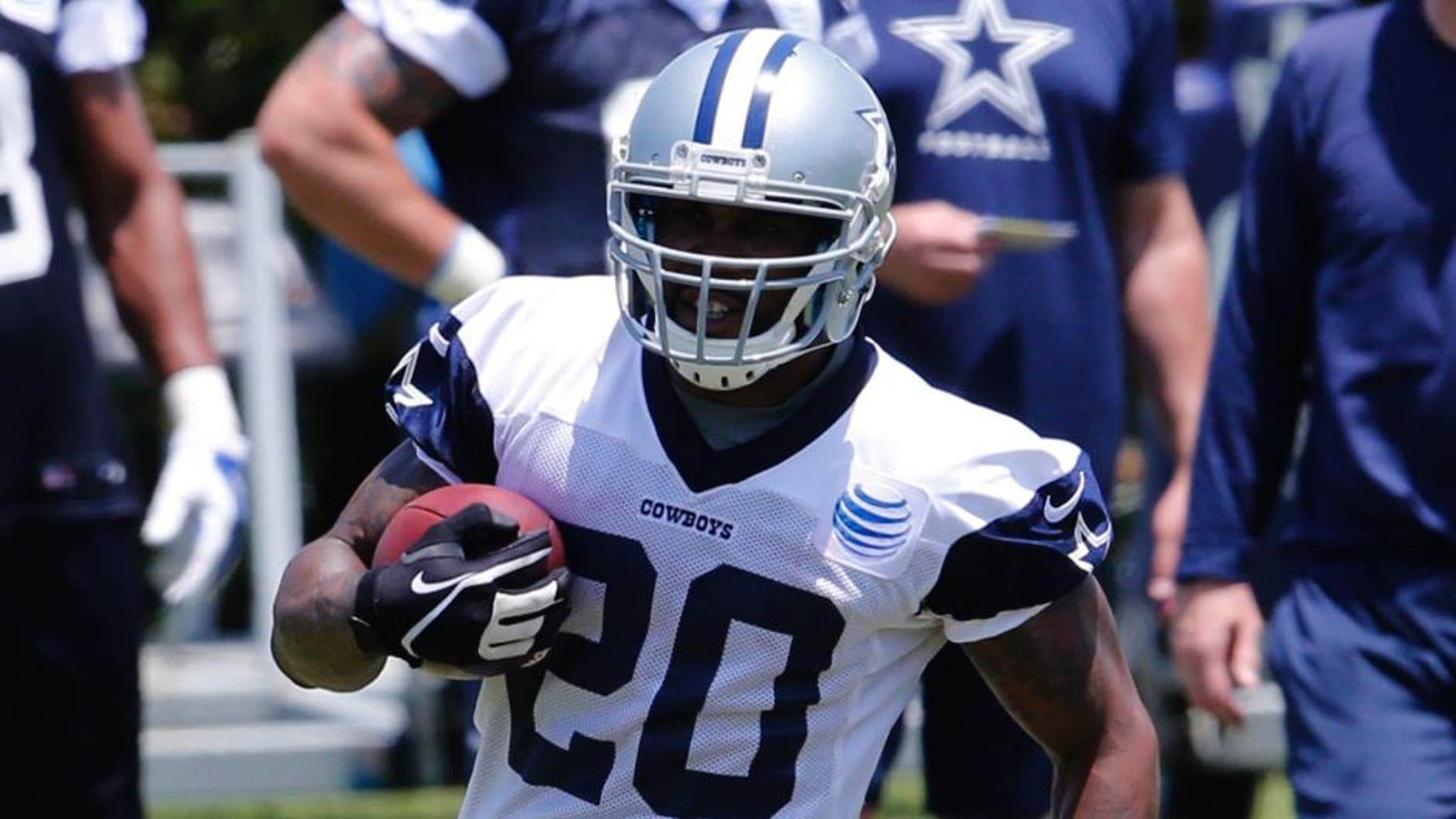 May 27, 2015; Dallas, TX, USA; Dallas Cowboys running back Darren McFadden (20) runs with the ball during OTAs at Dallas Cowboys Headquarters. Mandatory Credit: Matthew Emmons-USA TODAY Sports