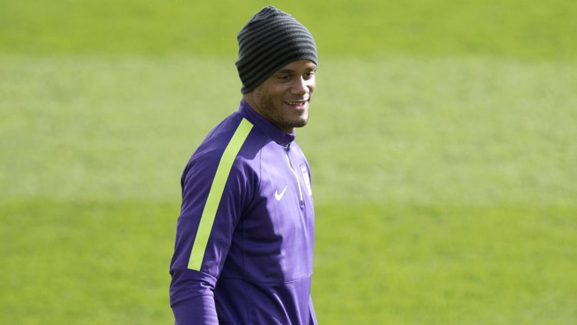 Manchester City's Belgian defender Vincent Kompany takes part in a training session at the City Football Academy in Manchester, northwest England, on February 23, 2015 ahead of their UEFA Champions League round of 16 first leg football match against Barcelona . AFP PHOTO / OLI SCARFF (Photo credit should read OLI SCARFF/AFP/Getty Images)
