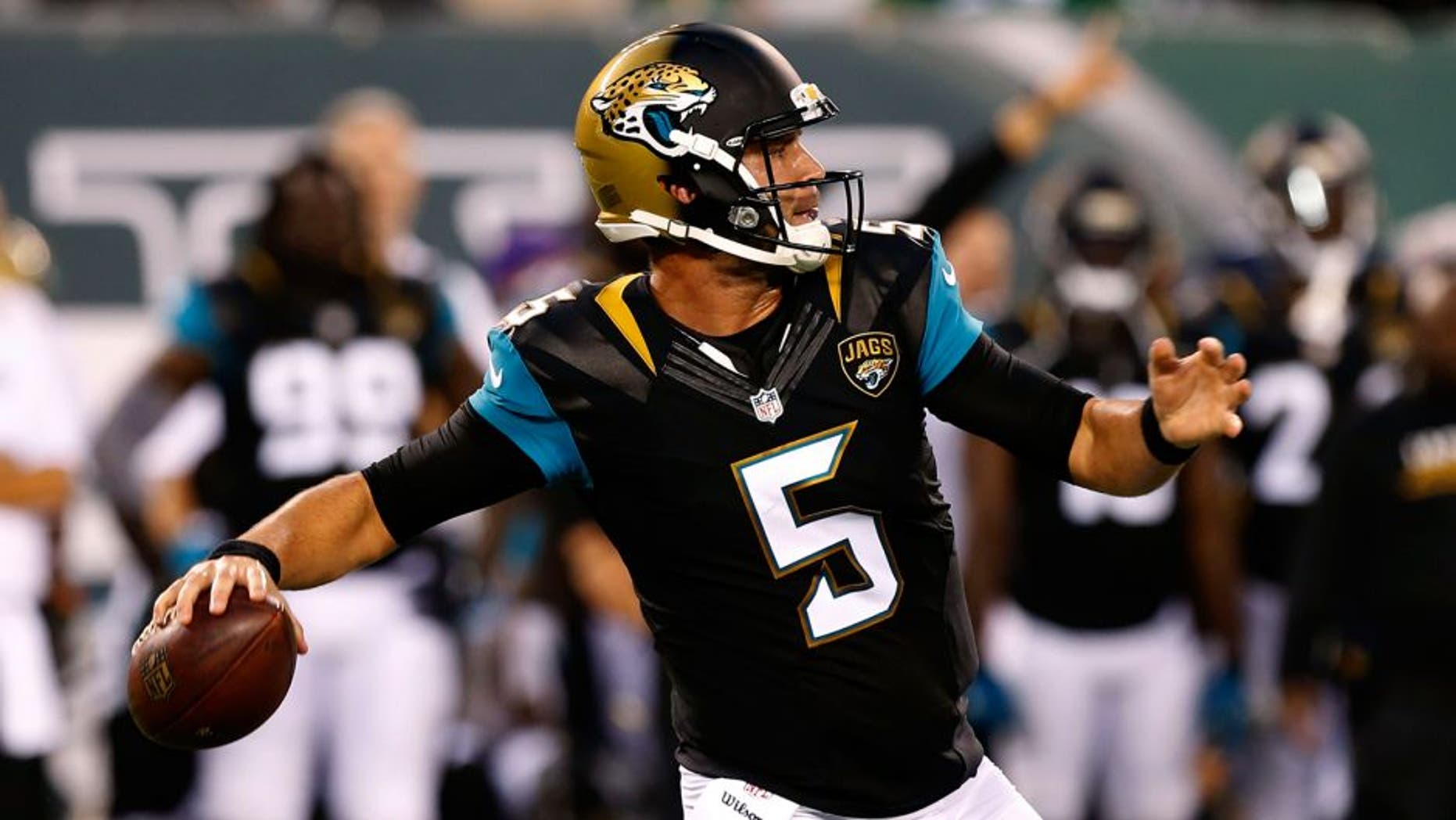 Aug 11, 2016; East Rutherford, NJ, USA; Jacksonville Jaguars quarterback Blake Bortles (5) drops back to pass against the New York Jets during first half at MetLife Stadium. Mandatory Credit: Noah K. Murray-USA TODAY Sports