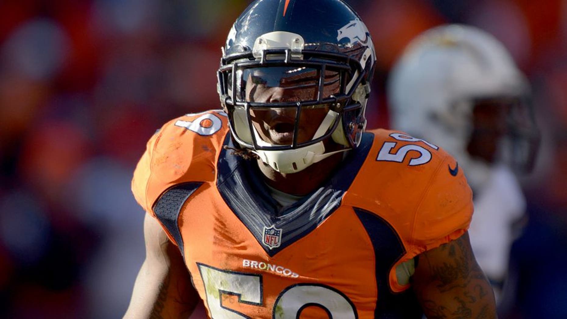 Jan 12, 2014; Denver, CO, USA; Denver Broncos linebacker Danny Trevathan (59) during the 2013 AFC divisional playoff football game against the San Diego Chargers at Sports Authority Field at Mile High. Mandatory Credit: Kirby Lee-USA TODAY Sports