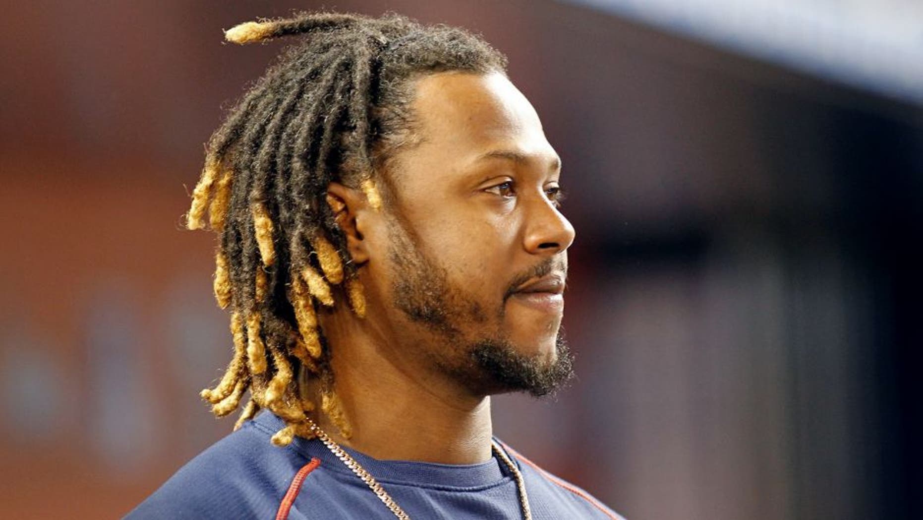 MIAMI, FL - AUGUST 11: Hanley Ramirez #13 of the Boston Red Sox stands in the dugout as the Red Sox played the Miami Marlins at Marlins Park on August 11, 2015 in Miami, Florida. (Photo by Joe Skipper/Getty Images)