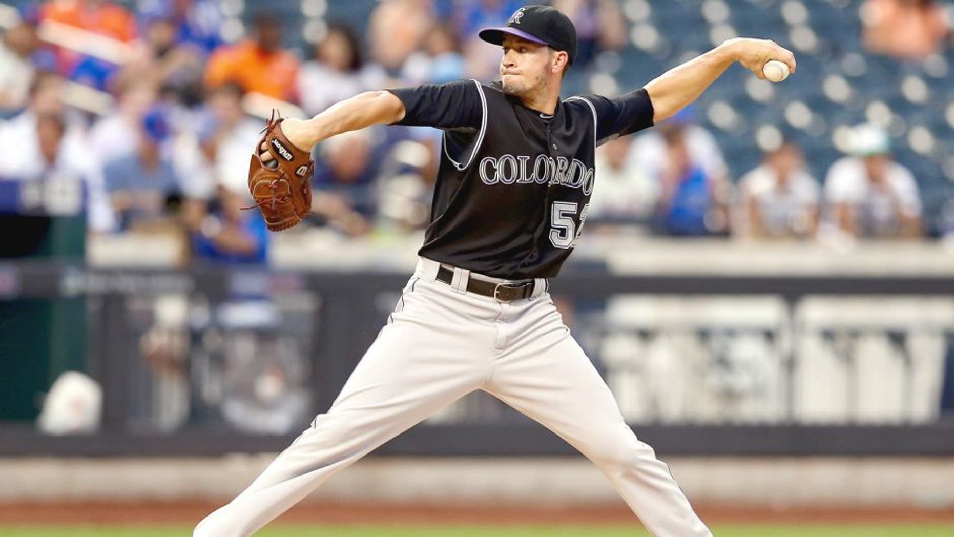 NEW YORK, NY - AUGUST 11: Chris Rusin #52 of the Colorado Rockies delivers a pitch in the first inning against the New York Mets on August 11, 2015 at Citi Field in the Flushing neighborhood of the Queens borough of New York City. (Photo by Elsa/Getty Images)