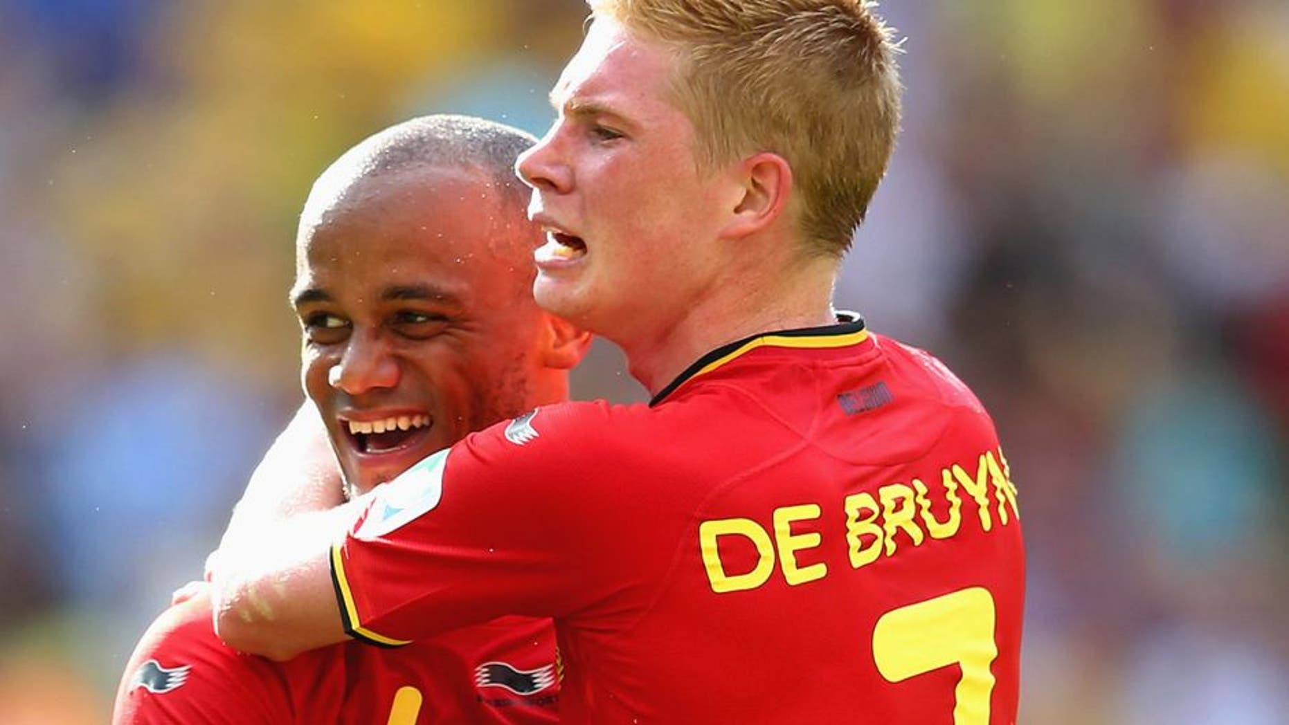RIO DE JANEIRO, BRAZIL - JUNE 22: Vincent Kompany and Kevin De Bruyne of Belgium celebrate during the 2014 FIFA World Cup Brazil Group H match between Belgium and Russia at Maracana on June 22, 2014 in Rio de Janeiro, Brazil. (Photo by Julian Finney/Getty Images)