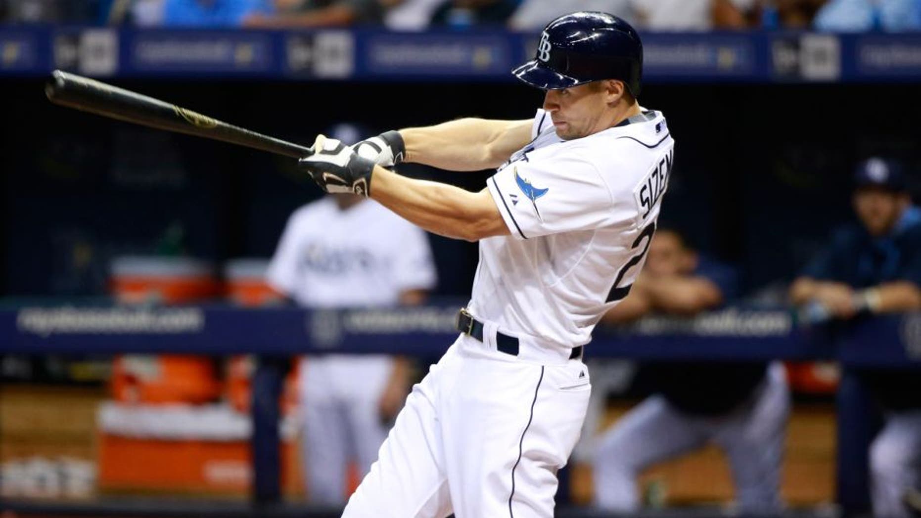 Aug 12, 2015; St. Petersburg, FL, USA; Tampa Bay Rays left fielder Grady Sizemore (24) singles during the third inning against the Atlanta Braves at Tropicana Field. Mandatory Credit: Kim Klement-USA TODAY Sports