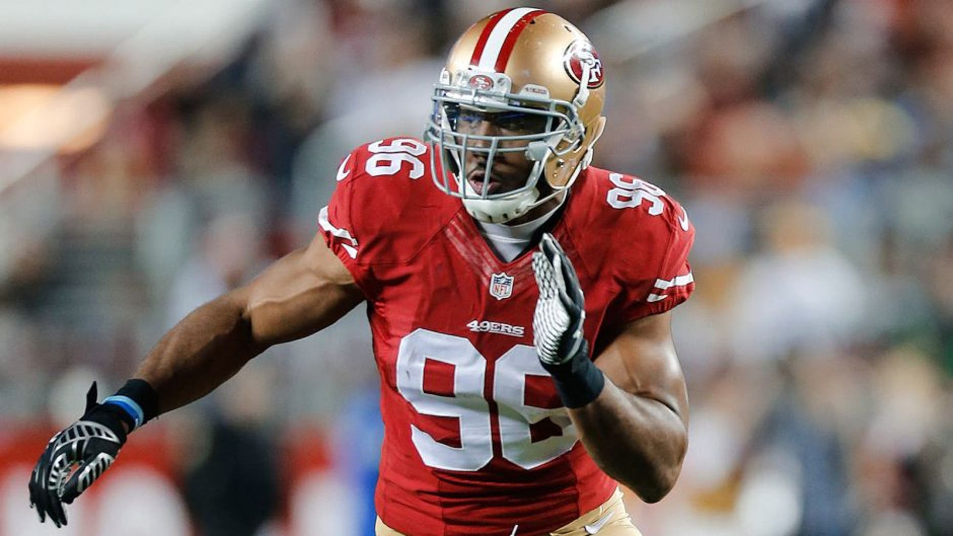 SANTA CLARA, CA - DECEMBER 20: Corey Lemonier #96 of the San Francisco 49ers rushes the passer during the game against the San Diego Chargers at Levi Stadium on December 20, 2014 in Santa Clara, California. The Chargers defeated the 49ers 38-35 in overtime. (Photo by Michael Zagaris/San Francisco 49ers/Getty Images)