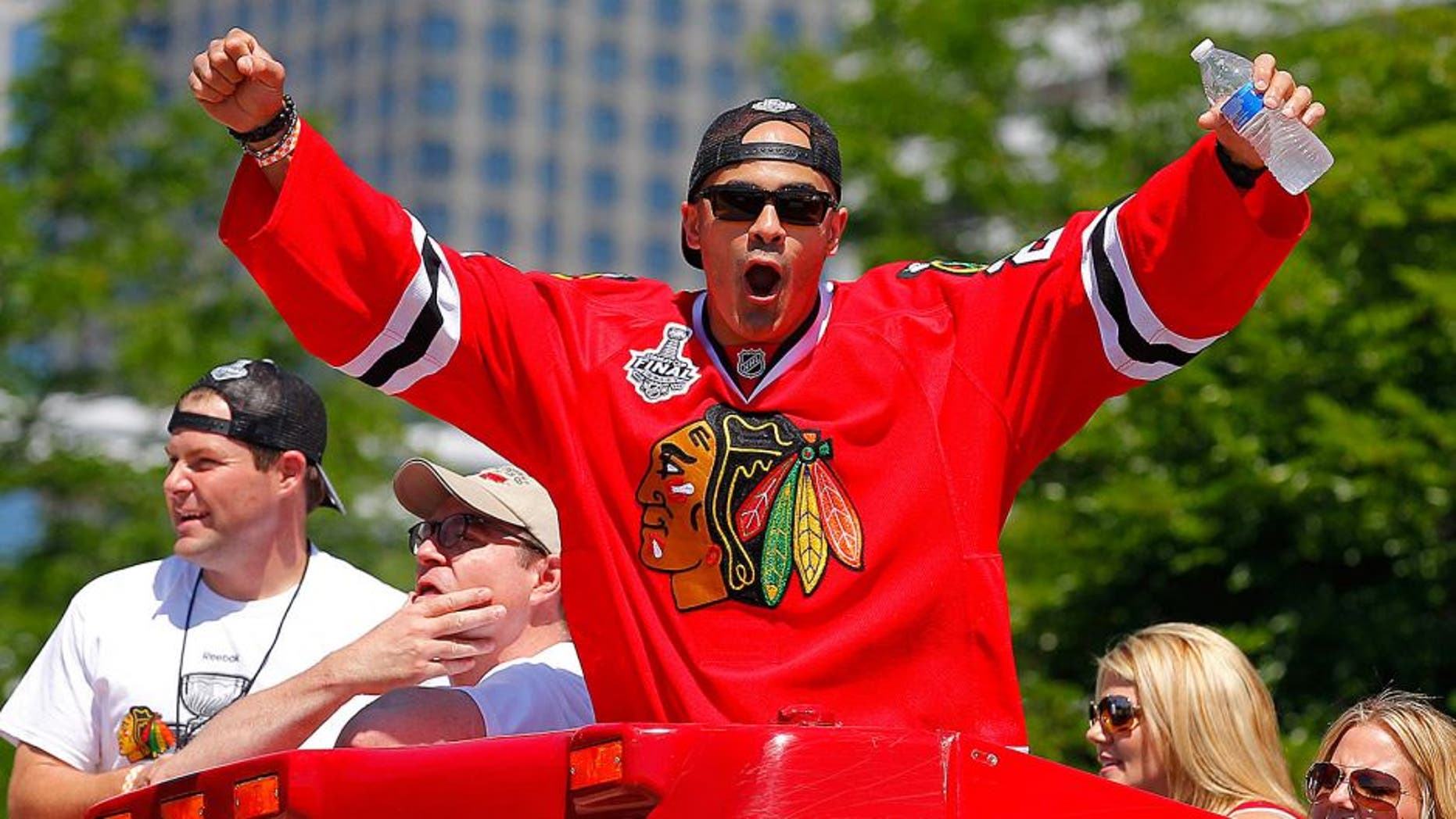 Jun 28, 2013; Chicago, IL, USA; Chicago Blackhawks center Jamal Mayers (22) during the 2013 Stanley Cup championship celebration parade in downtown Chicago. Mandatory Credit: Dennis Wierzbicki-USA TODAY Sports