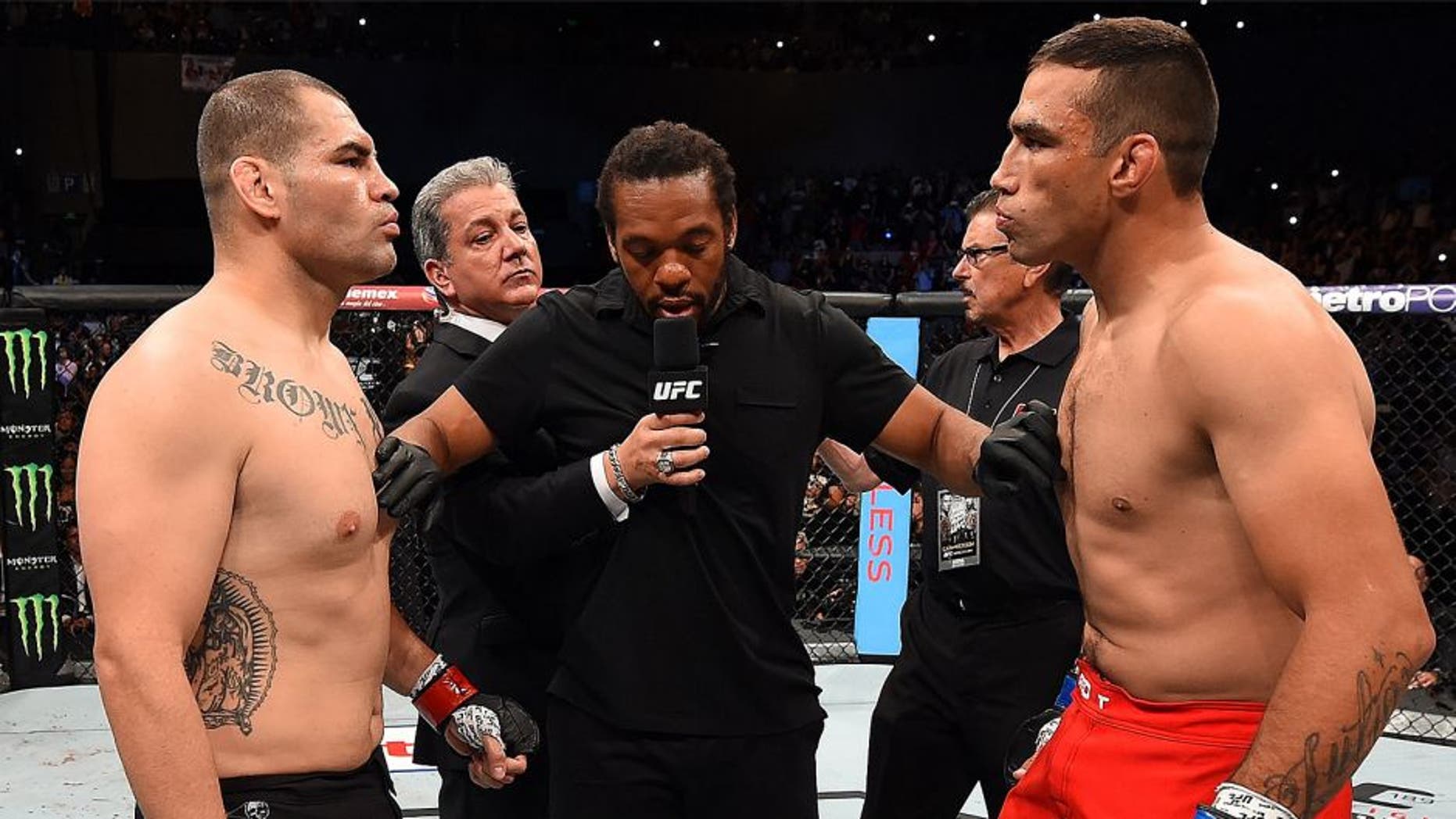 MEXICO CITY, MEXICO - JUNE 13: (L-R) Cain Velasquez of the United States and Fabricio Werdum of Brazil face off before their UFC heavyweight championship bout during the UFC 188 event inside the Arena Ciudad de Mexico on June 13, 2015 in Mexico City, Mexico. (Photo by Josh Hedges/Zuffa LLC/Zuffa LLC via Getty Images)
