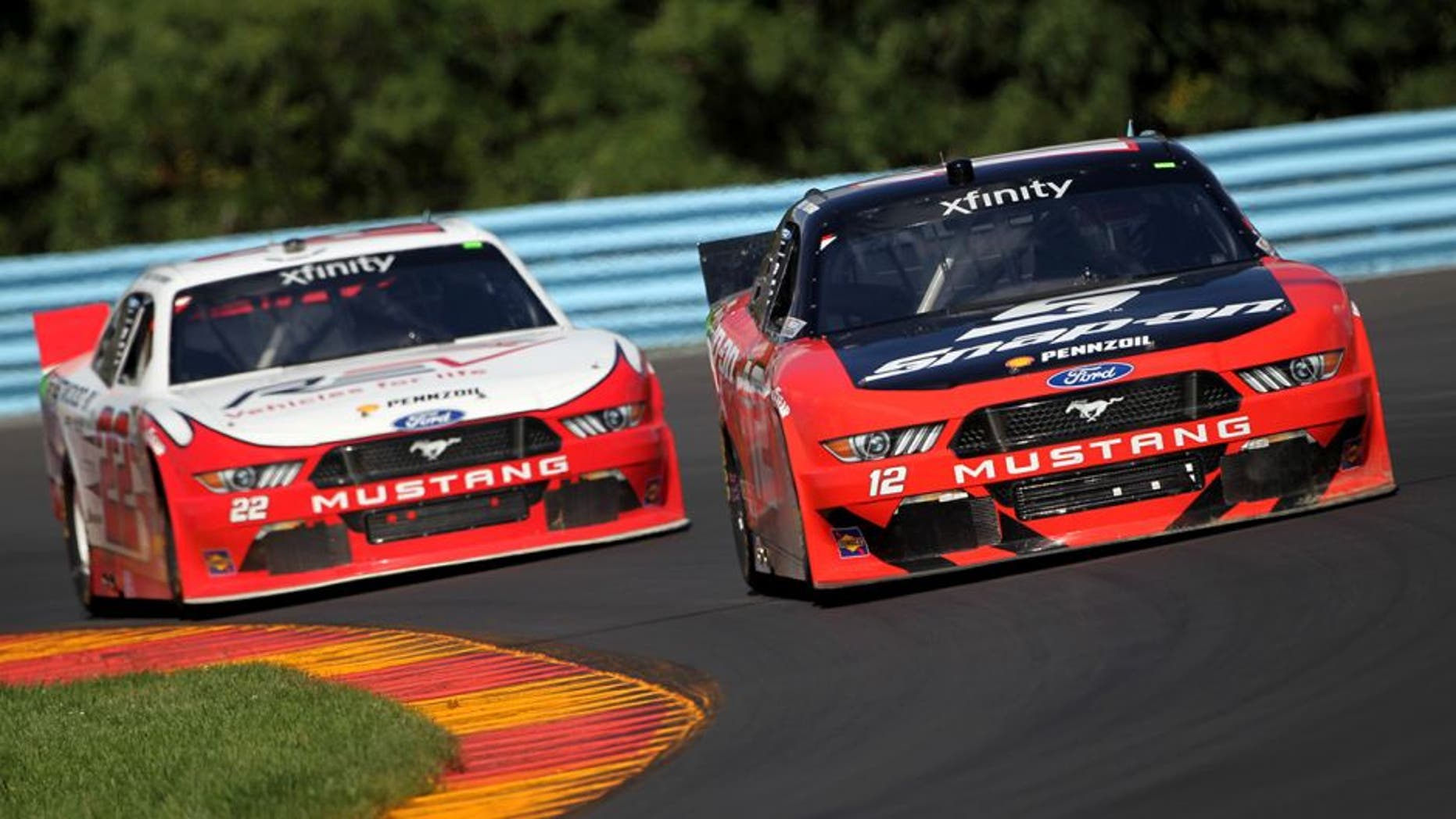 WATKINS GLEN, NY - AUGUST 06: Joey Logano, driver of the #12 Snap-On Ford, races Brad Keselowski, driver of the #22 Fleetwood/REV Group Ford, during the NASCAR XFINITY Series Zippo 200 at Watkins Glen International on August 6, 2016 in Watkins Glen, New York. (Photo by Brian Lawdermilk/Getty Images)