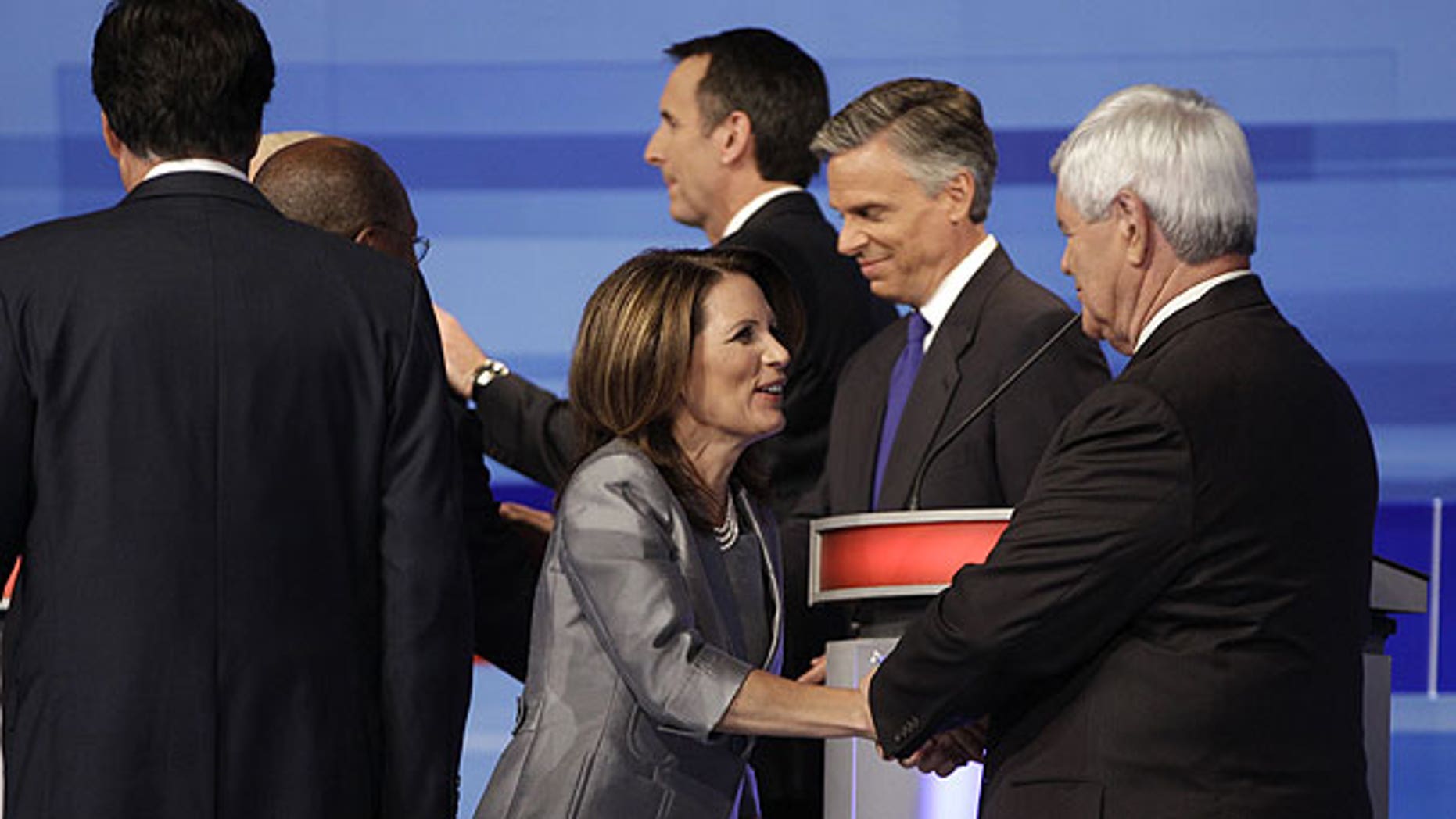 August 11: Republican presidential candidates speak at the end of the Iowa GOP/Fox News Debate at the CY Stephens Auditorium in Ames, Iowa.