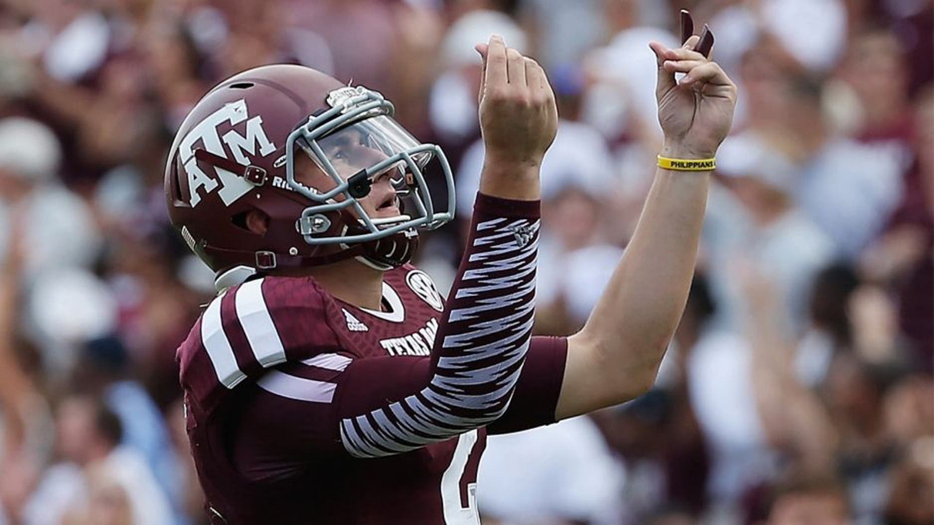 COLLEGE STATION, TX - AUGUST 31: Johnny Manziel #2 of the Texas A&M Aggies celebrates a third quarter touchdown during the game against the Rice Owls at Kyle Field on August 31, 2013 in College Station, Texas. (Photo by Scott Halleran/Getty Images)