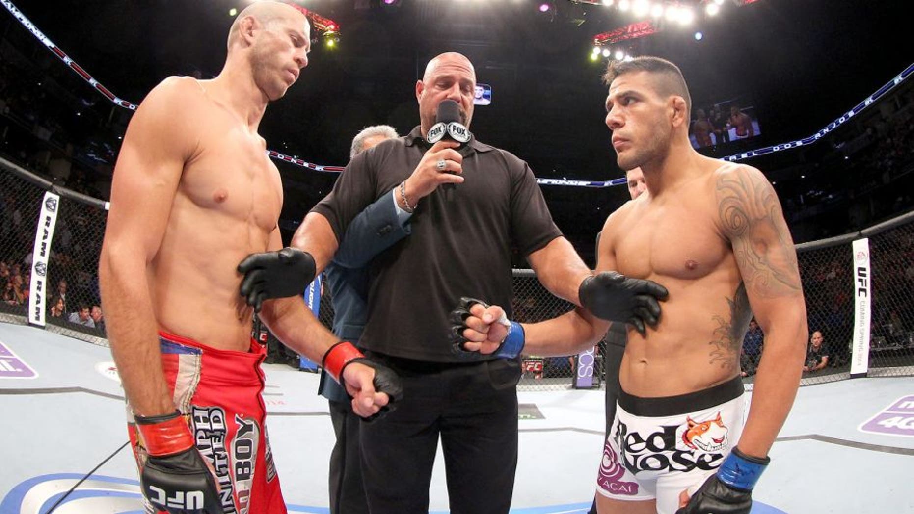 INDIANAPOLIS, IN - AUGUST 28: (L-R) Opponents Donald "Cowboy" Cerrone and Rafael dos Anjos face off before their lightweight fight during the UFC on FOX Sports 1 event at Bankers Life Fieldhouse on August 28, 2013 in Indianapolis, Indiana. (Photo by Ed Mulholland/Zuffa LLC/Zuffa LLC via Getty Images)