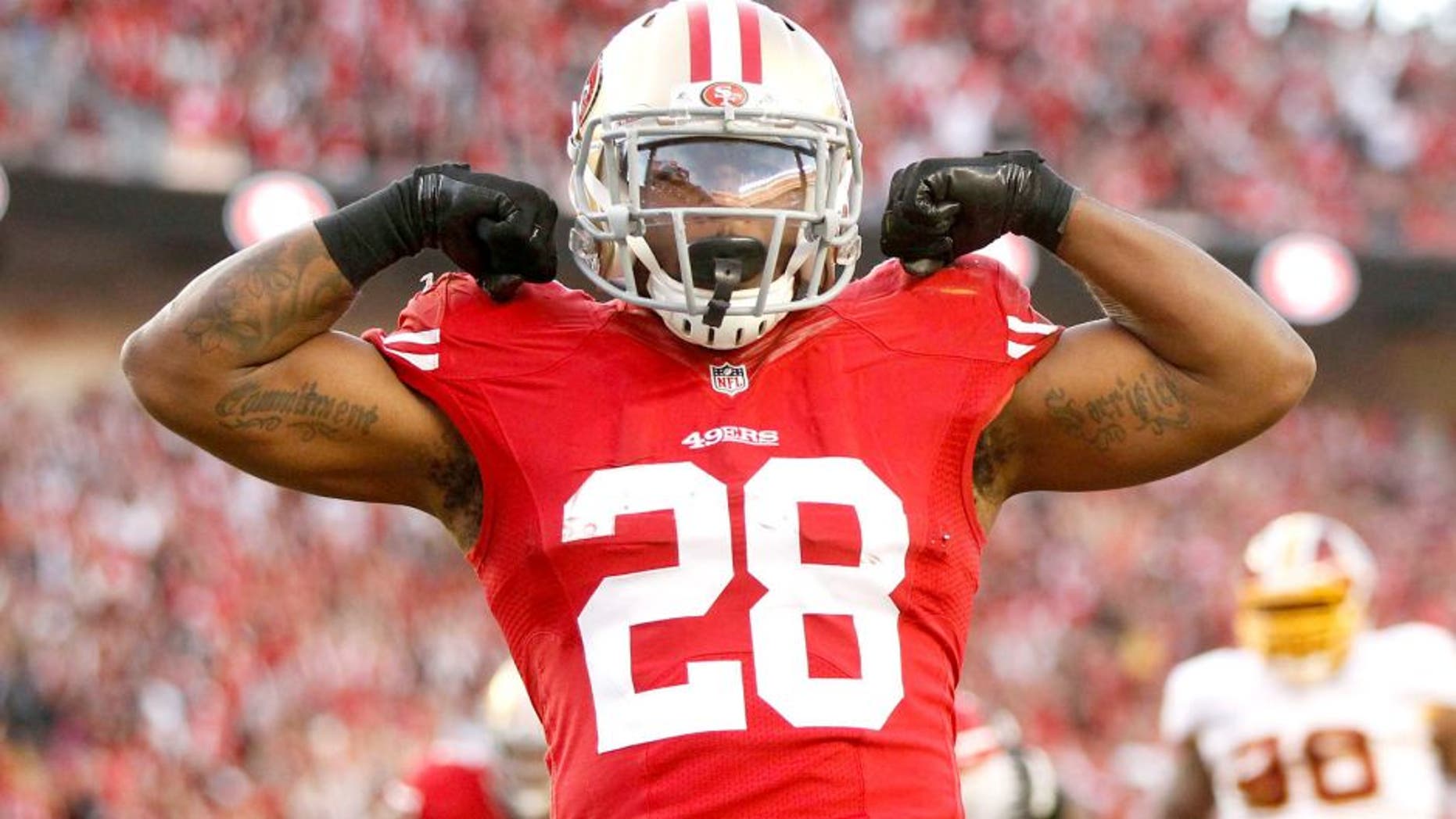 Nov 23, 2014; Santa Clara, CA, USA; San Francisco 49ers running back Carlos Hyde (28) reacts after scoring a touchdown against the Washington Redskins in the fourth quarter at Levi's Stadium. The 49ers defeated the Redskins 17-13. Mandatory Credit: Cary Edmondson-USA TODAY Sports