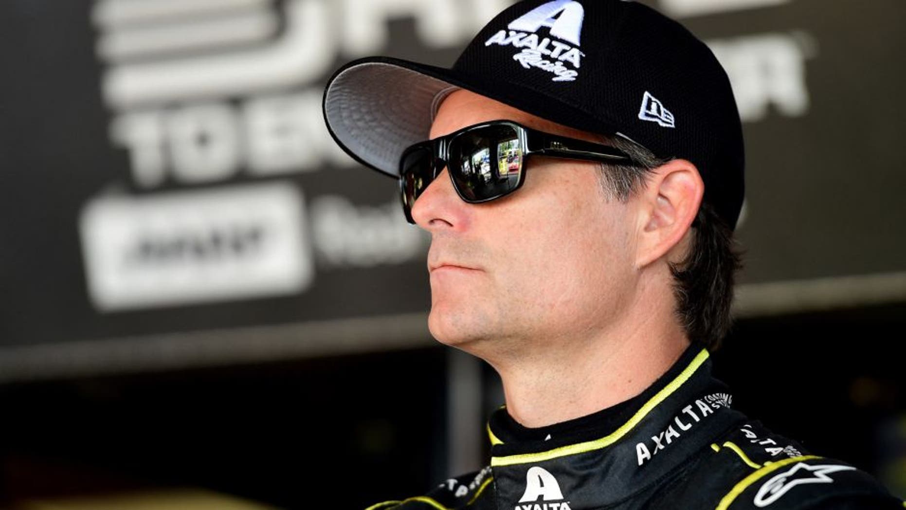 WATKINS GLEN, NY - AUGUST 07: Jeff Gordon, driver of the #24 Axalta Chevrolet, stands in the garage area during practice for the NASCAR Sprint Cup Series Cheez-It 355 at Watkins Glen International on August 7, 2015 in Watkins Glen, New York. (Photo by Jared C. Tilton/NASCAR via Getty Images)