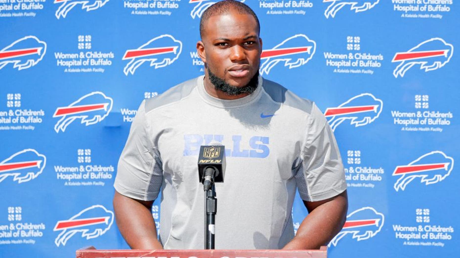 Buffalo Bills' IK Enemkpali, released this week by the New York Jets, speaks to the media at NFL football training camp, Thursday, Aug. 13, 2015, in Pittsford, N.Y. The Bills claimed the second-year player off of waivers on Wednesday, a day after he was released by the Jets because he hit quarterback Geno Smith with a sucker punch, breaking his jaw. (AP Photo/Mike Groll)