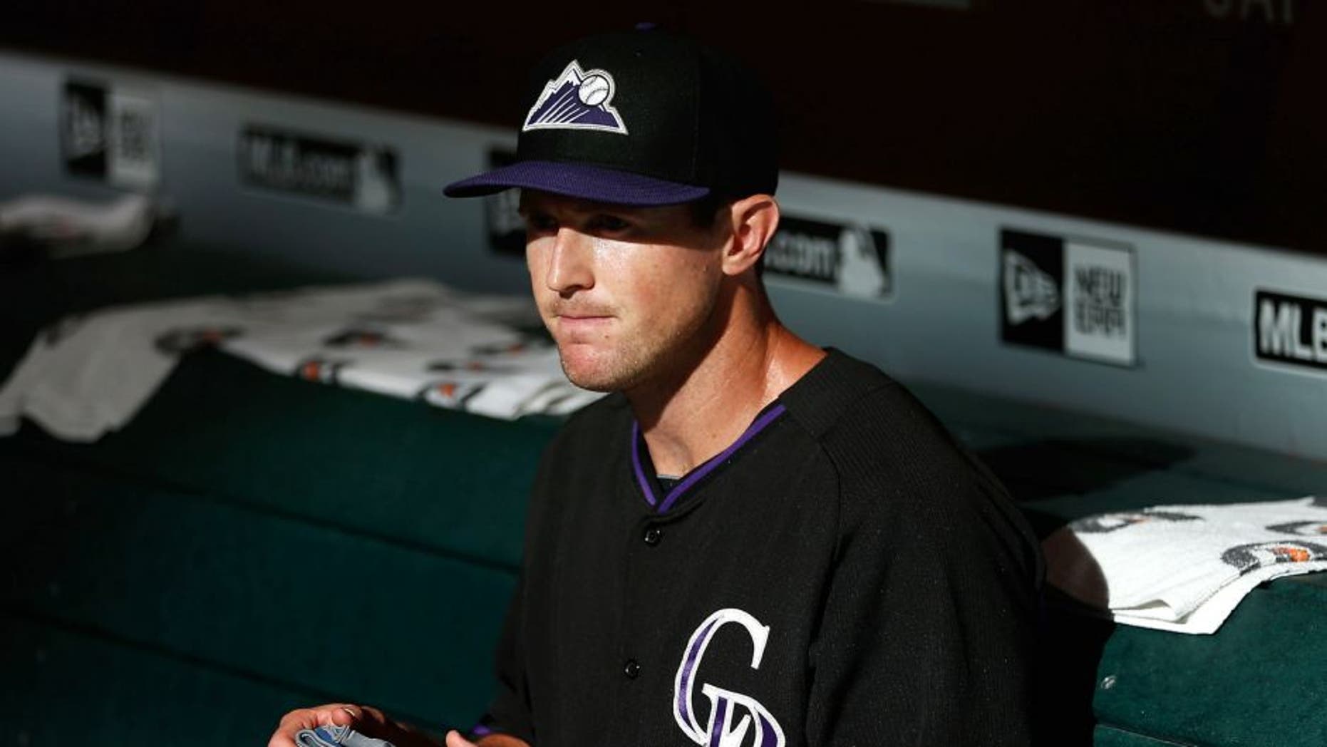 PHOENIX, AZ - JULY 03: Drew Stubbs #13 of the Colorado Rockies sits in the dugout before the MLB game against the Arizona Diamondbacks at Chase Field on July 3, 2015 in Phoenix, Arizona. (Photo by Christian Petersen/Getty Images)