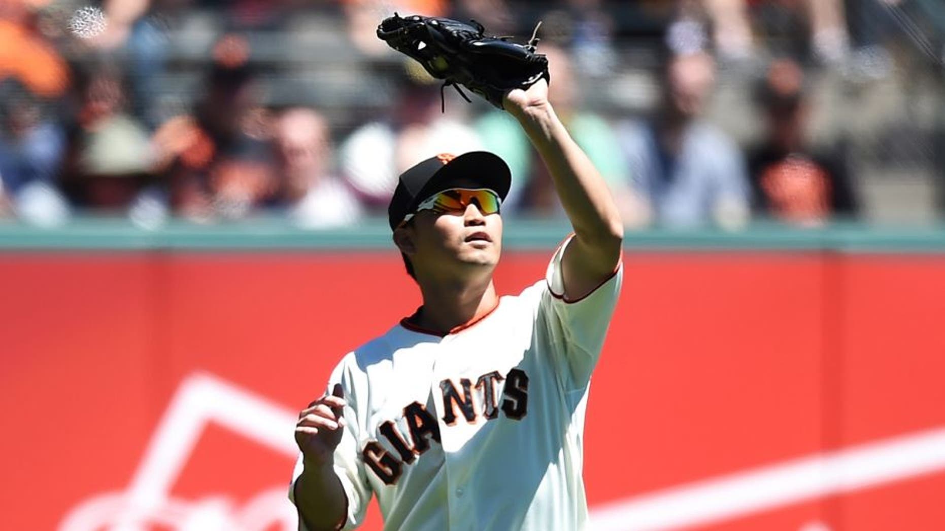 SAN FRANCISCO, CA - AUGUST 12: Nori Aoki #23 of the San Francisco Giants catches a fly ball off the bat of Preston Tucker #20 of the Houston Astros in the top of the fourth inning at AT&T Park on August 12, 2015 in San Francisco, California. (Photo by Thearon W. Henderson/Getty Images)