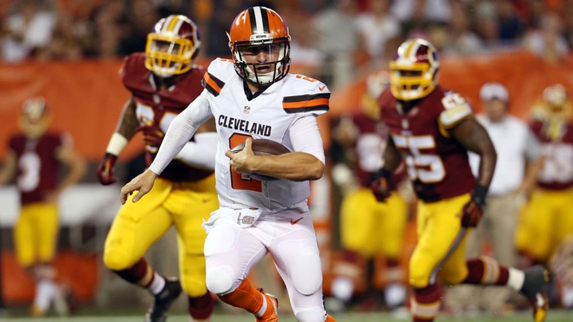 Cleveland Browns quarterback Johnny Manziel (2) scrambles for a 12-yard touchdown during the second quarter of an NFL preseason football game against the Washington Redskins, Thursday, Aug. 13, 2015, in Cleveland. (AP Photo/Ron Schwane)