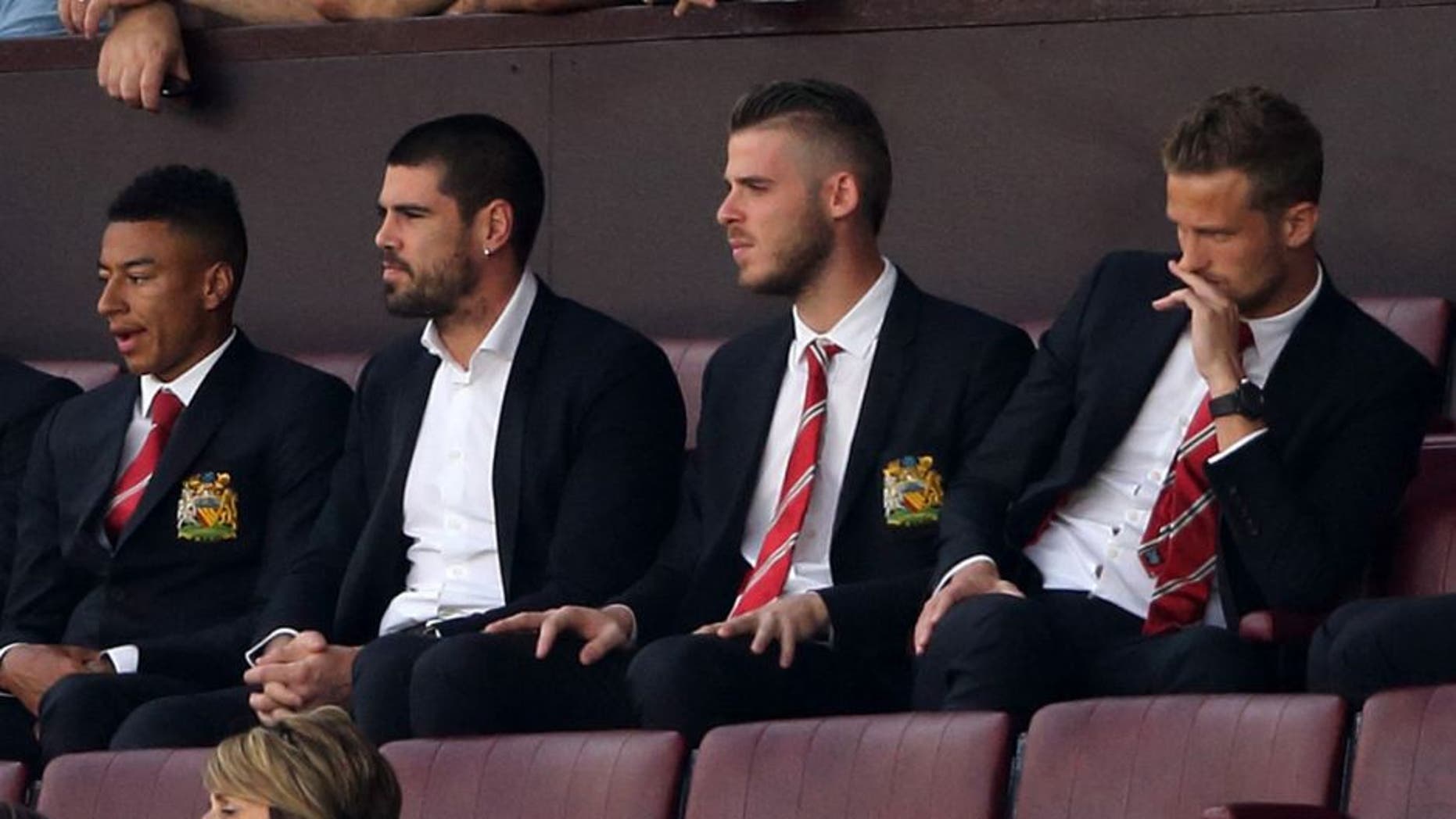 MANCHESTER, ENGLAND - AUGUST 08: Goalkeepers Victor Valdes and David De Gea of Manchester United watch the game from the stands during the Barclays Premier League match between Manchester United and Tottenham Hotspur at Old Trafford on August 08, 2015 in Manchester, England. (Photo by Matthew Ashton - AMA/Getty Images)