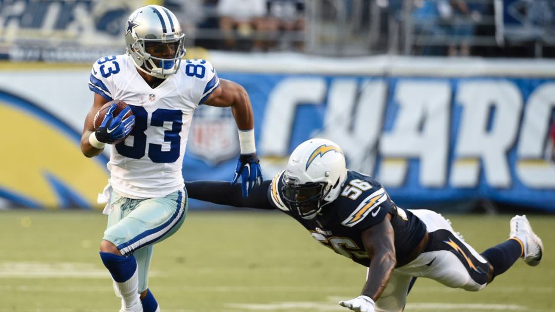 Dallas Cowboys wide receiver Terrance Williams runs upfield after a completion as San Diego Chargers inside linebacker Donald Butler defends during the first half of an NFL preseason football game Thursday, Aug. 13, 2015 in San Diego. (AP Photo/Denis Poroy)
