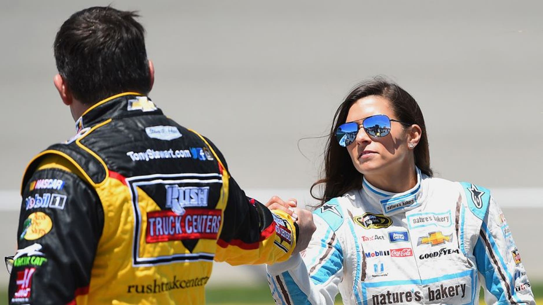 BROOKLYN, MI - JUNE 12: (L-R) Tony Stewart, driver of the #14 Rush Truck Centers/Mobil 1 Chevrolet, talks to Danica Patrick, driver of the #10 Nature's Bakery Chevrolet, on the grid prior to the NASCAR Sprint Cup Series FireKeepers Casino 400 at Michigan International Speedway on June 12, 2016 in Brooklyn, Michigan. (Photo by Josh Hedges/Getty Images )