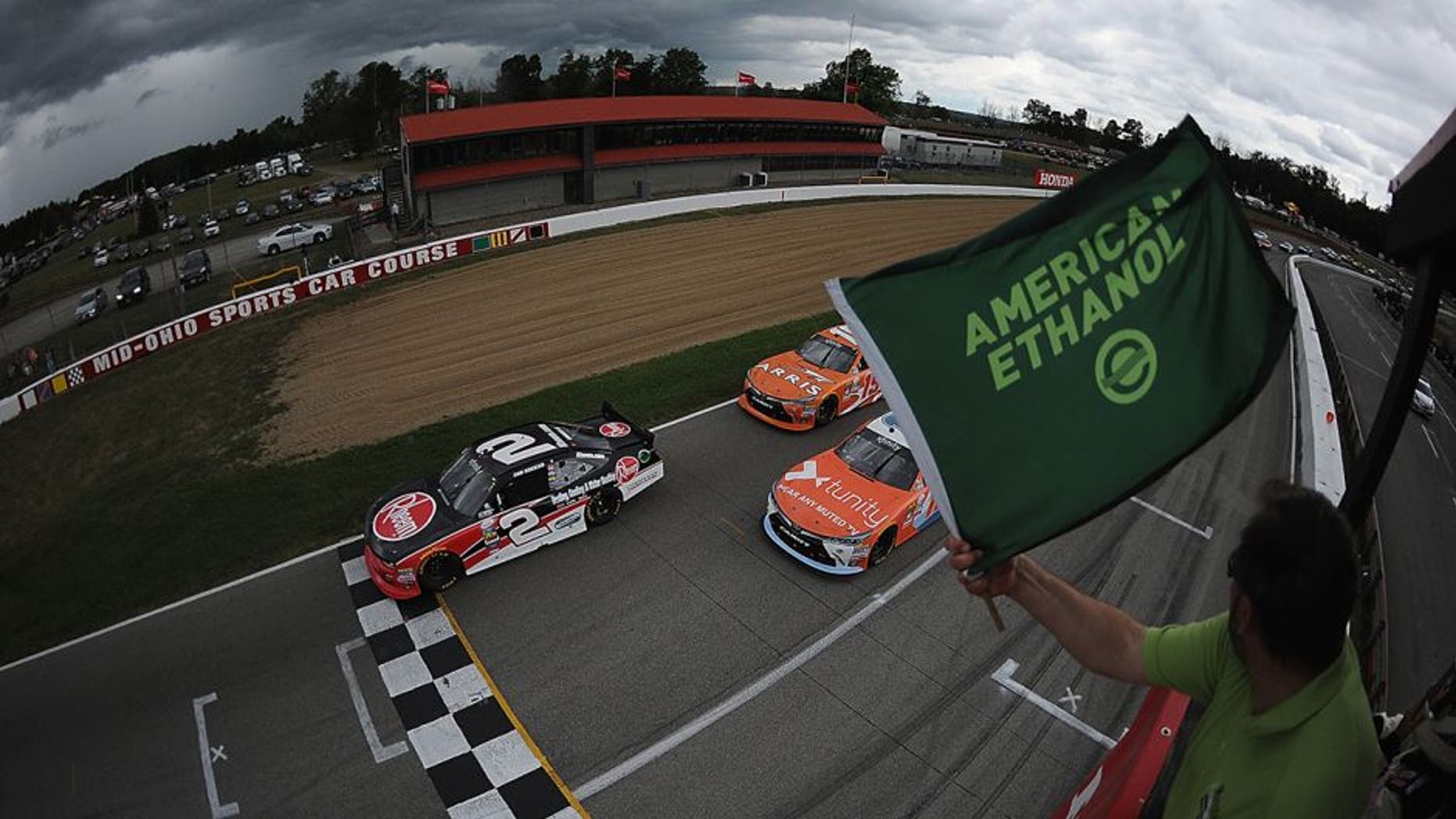 LEXINGTON, OH - AUGUST 13: Sam Hornish Jr., driver of the #2 Rheem Chevrolet and Owen Kelly, driver of the #18 Tunity Toyota, lead at the start of the 4th annual NASCAR XFINITY Series Mid-Ohio Challenge at Mid-Ohio Sports Car Course on August 13, 2016 in Lexington, Ohio. (Photo by Jonathan Moore/Getty Images)
