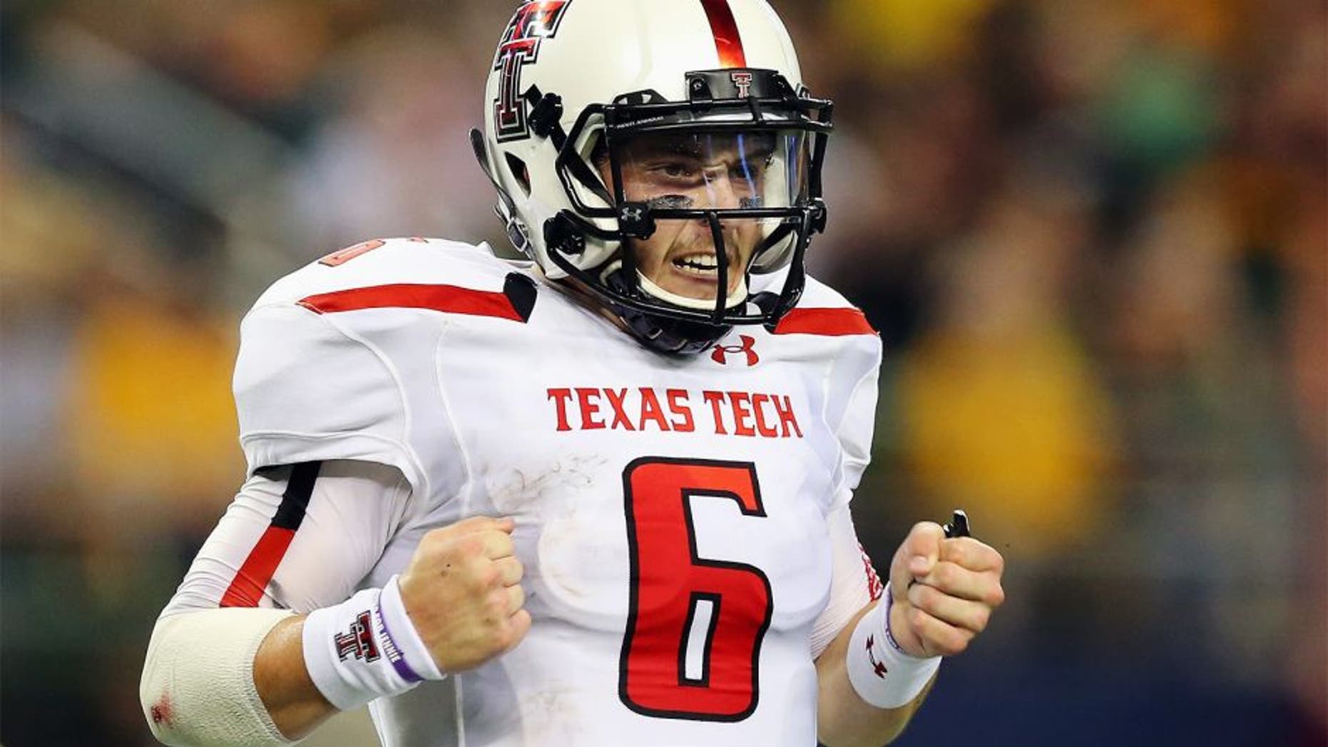 ARLINGTON, TX - NOVEMBER 16: Baker Mayfield #6 of the Texas Tech Red Raiders celebrates his second touchdown pass against the Baylor Bears at AT&T Stadium on November 16, 2013 in Arlington, Texas. (Photo by Ronald Martinez/Getty Images)