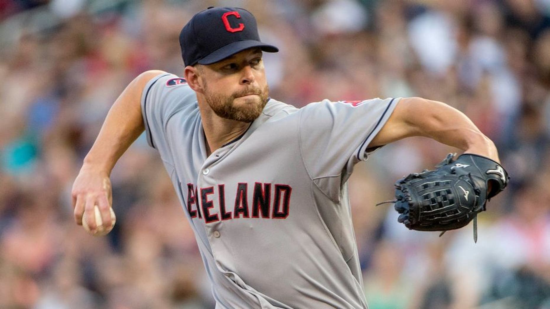 Aug 14, 2015; Minneapolis, MN, USA; Cleveland Indians starting pitcher Corey Kluber (28) delivers a pitch in the first inning against the Minnesota Twins at Target Field. Mandatory Credit: Jesse Johnson-USA TODAY Sports