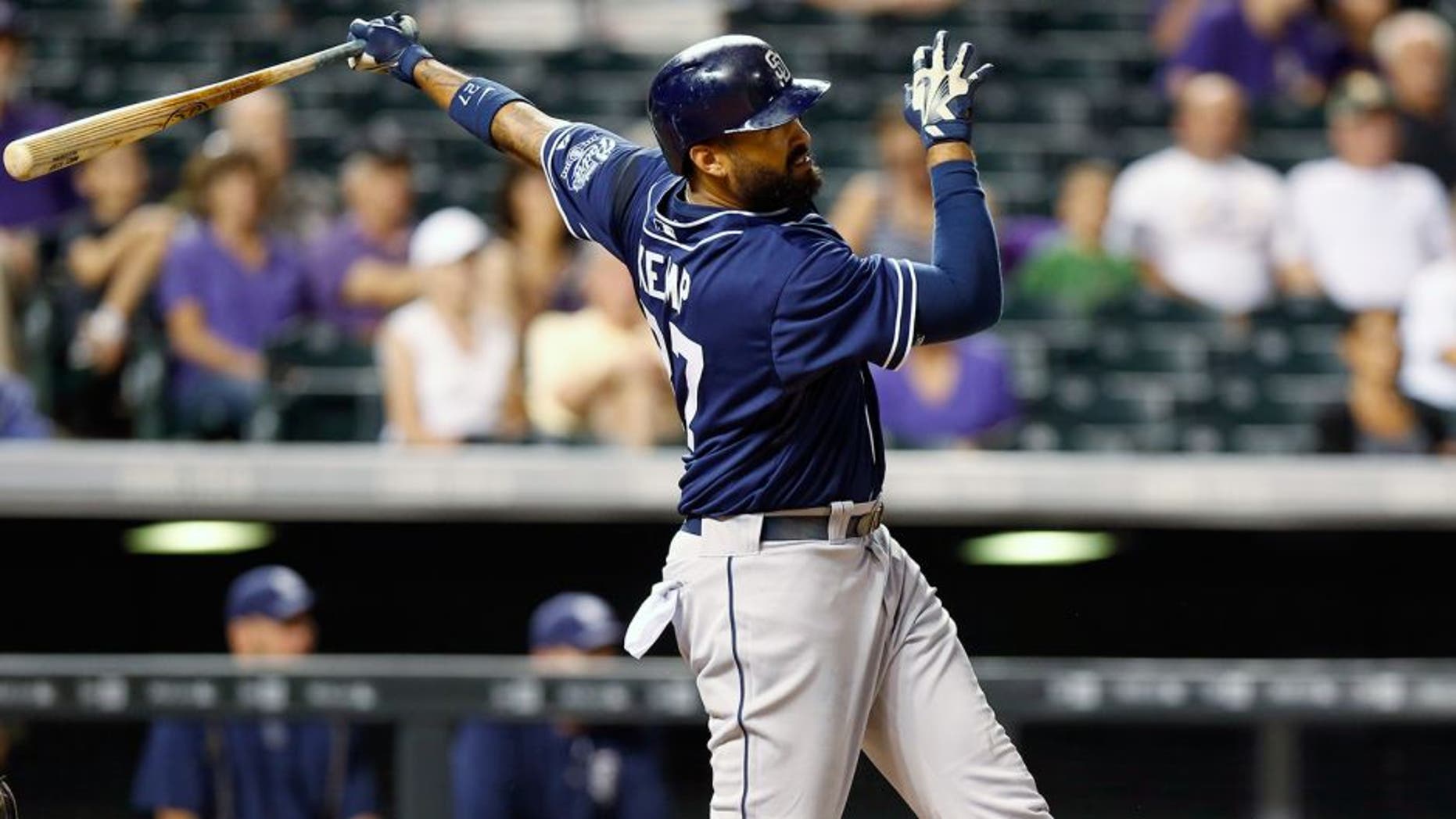 San Diego Padres' Matt Kemp watches his RBI triple off Colorado Rockies relief pitcher Justin Miller during the ninth inning of a baseball game Friday, Aug. 14, 2015, in Denver. With the triple, Kemp hit for the cycle as San Diego won 9-5. (AP Photo/David Zalubowski)